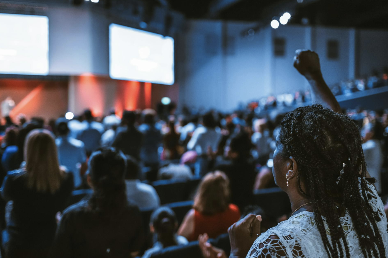 A woman protests at a conference