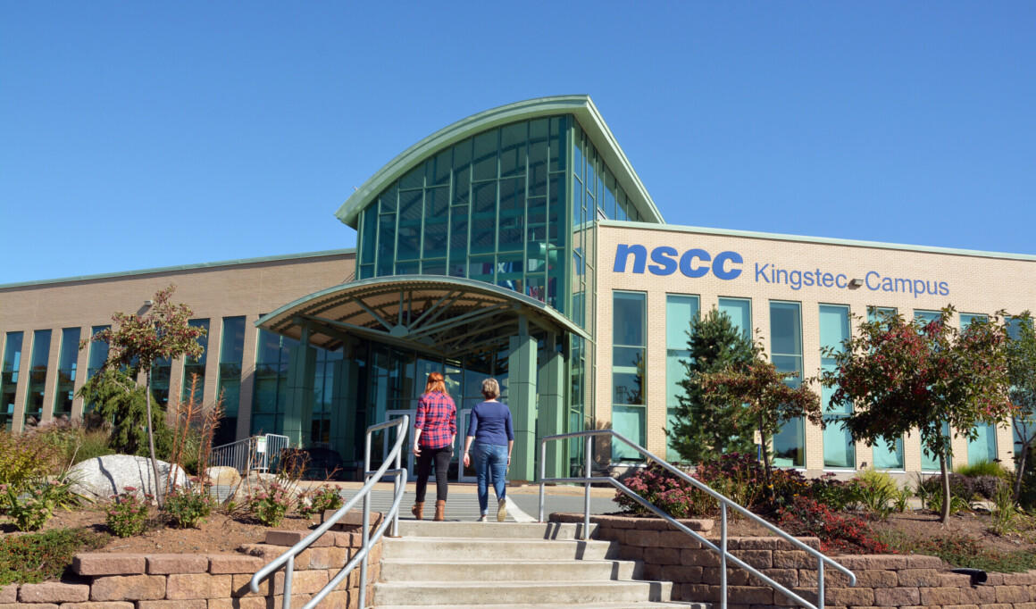 Graphic Design students walking up to one of the building of NSCC campus.