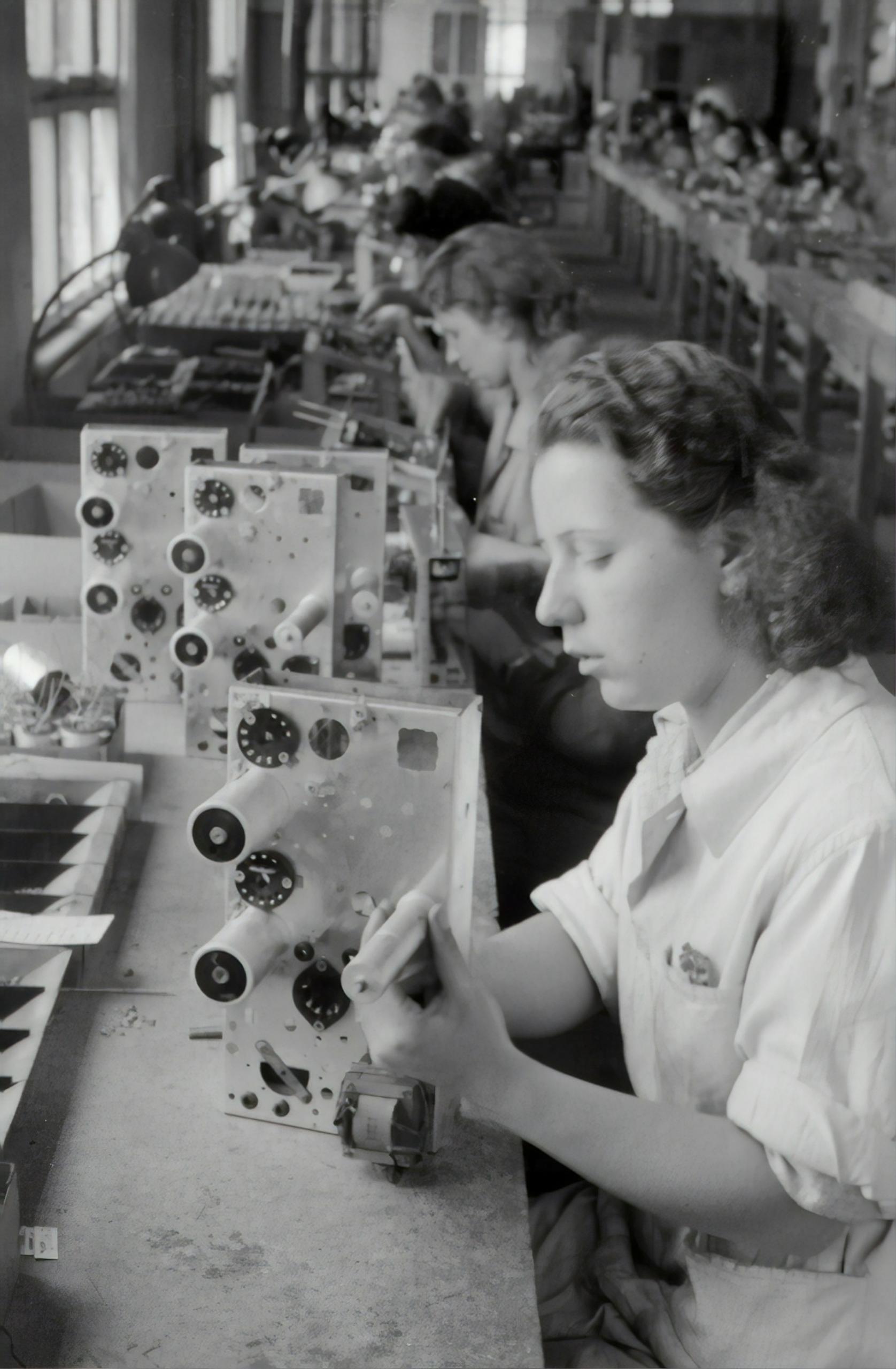 Canadian women begin to work in factories during the war.