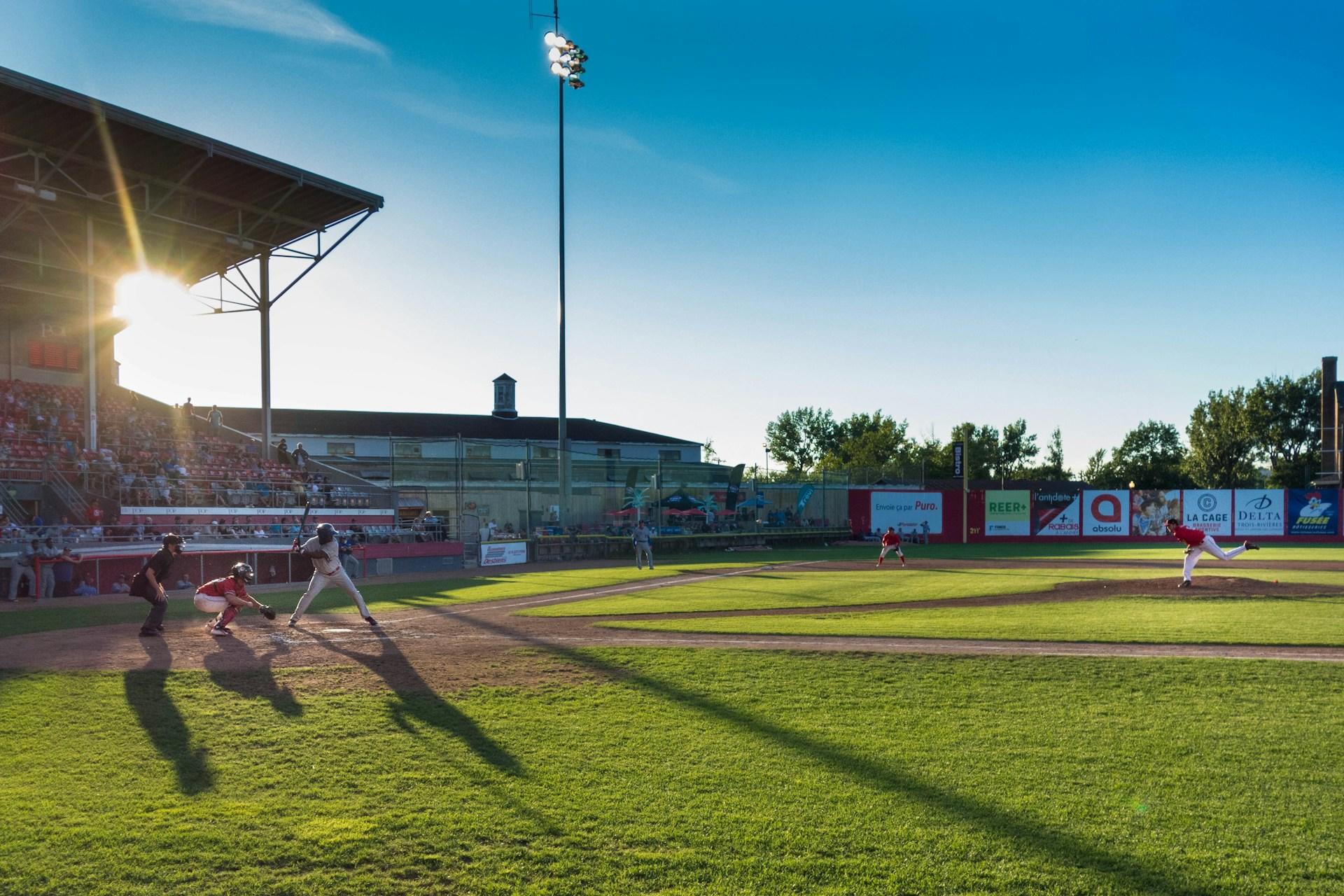 players playing baseball in a stadium