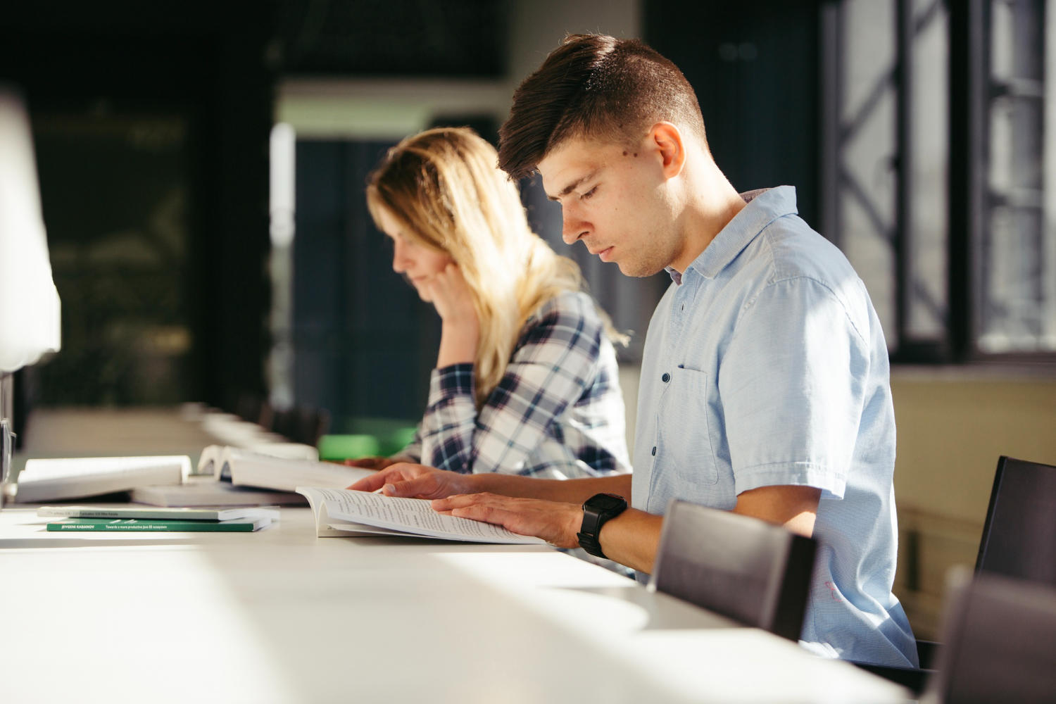 a male and a female student studying together