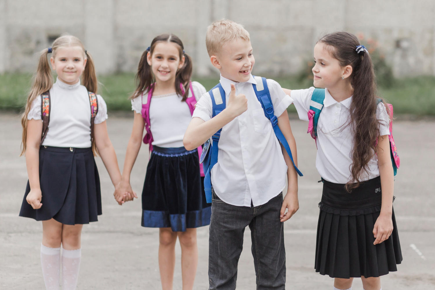 a group of young kids in uniform walking to school