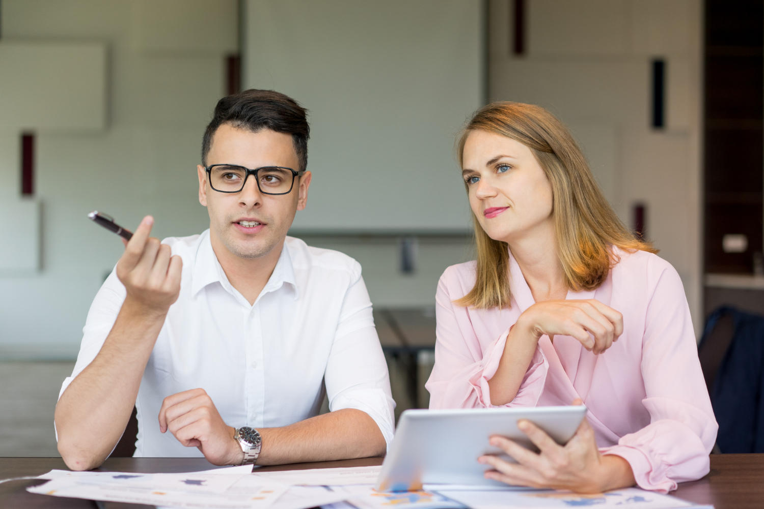 a man and woman discussing something toegther.