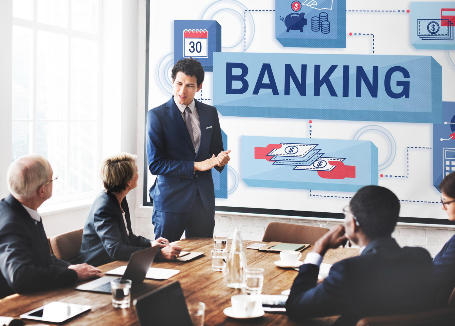 a group of people having a meeting about banking.