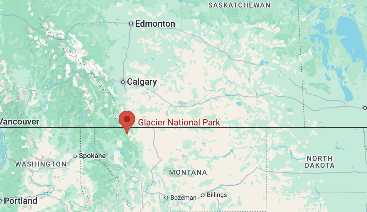 A map displaying Glacier National Park’s location in northwestern Montana, along the U.S.-Canada border. The map shows nearby cities such as Spokane, Washington, and Calgary, Alberta, along with the park’s positioning within a mountainous, forested area.