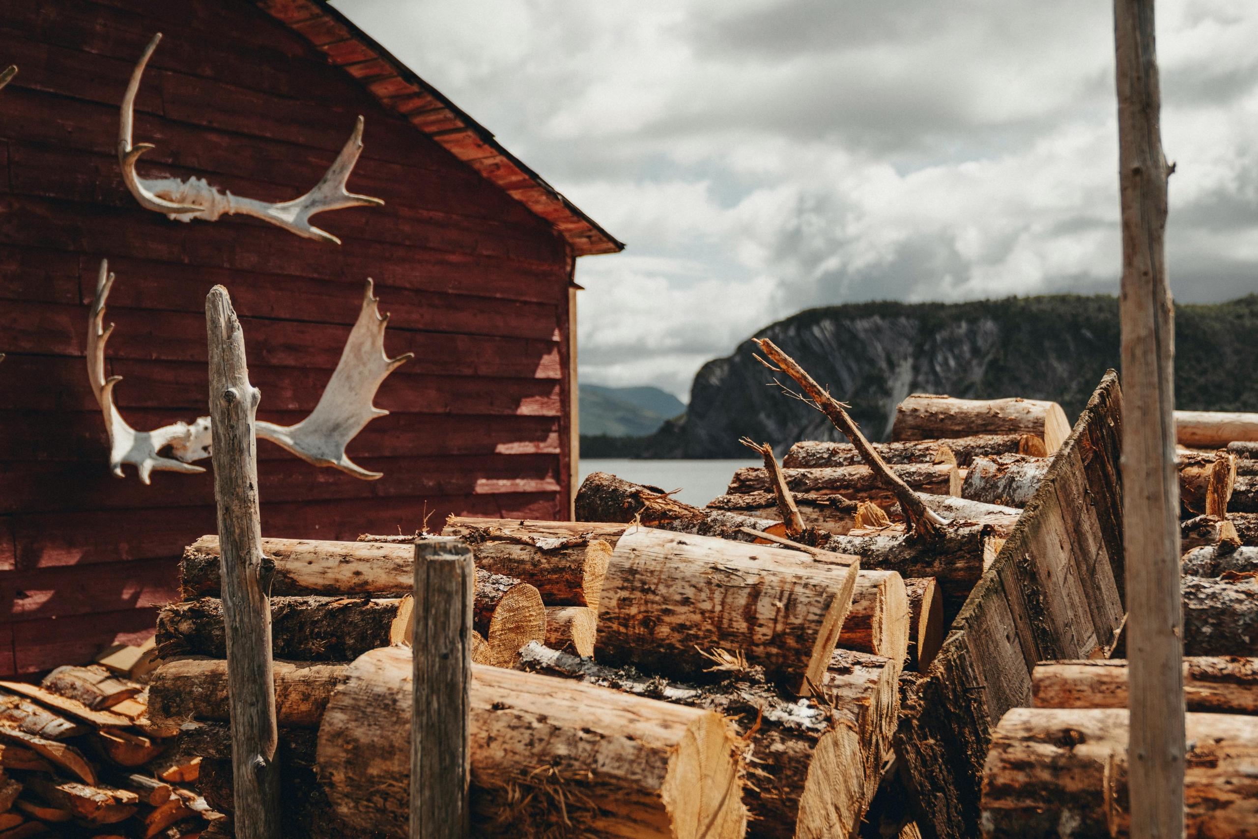 A rustic barn with moose antlers hanging on the wall in the Canadian countryside.