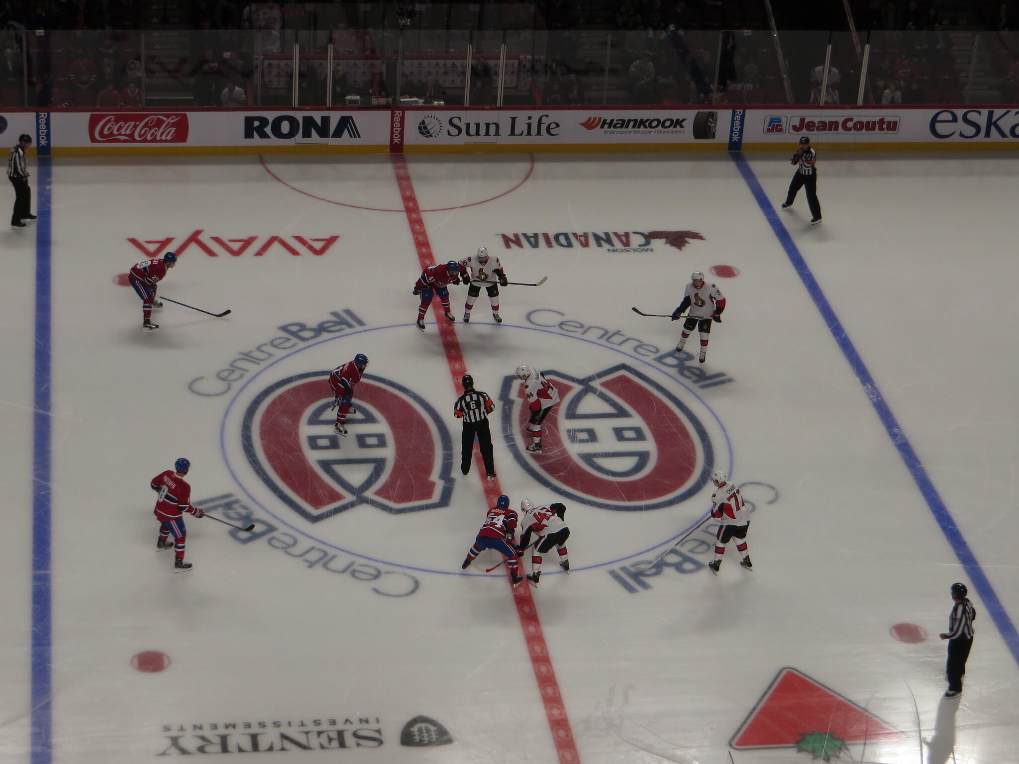Ottawa Senators players and Montreal Canadiens players on the ice at the Canadiens arena