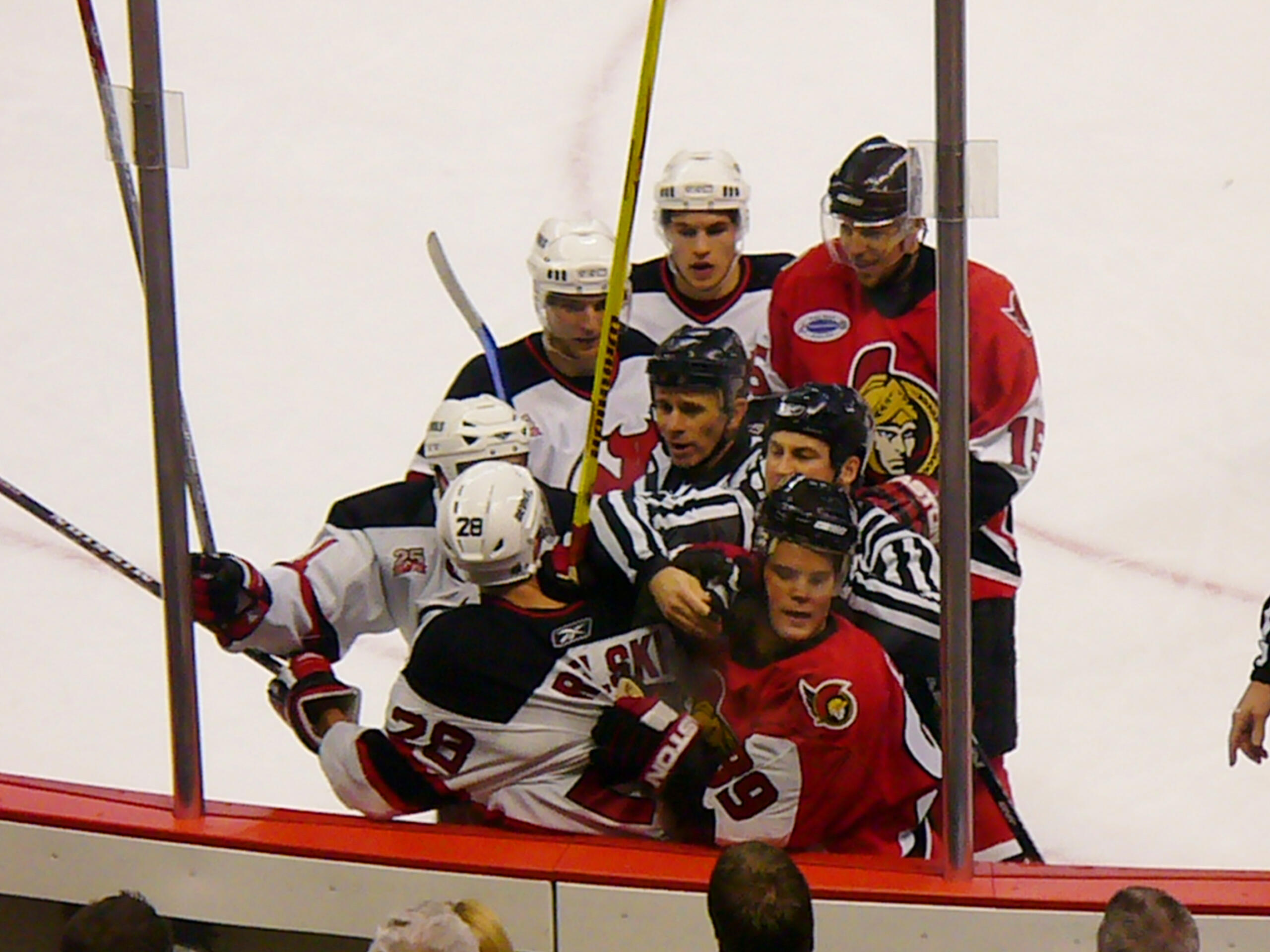 4 New Jersey Devils players, 3 Ottawa Senators players, and 2 referees involved in an on-ice brawl
