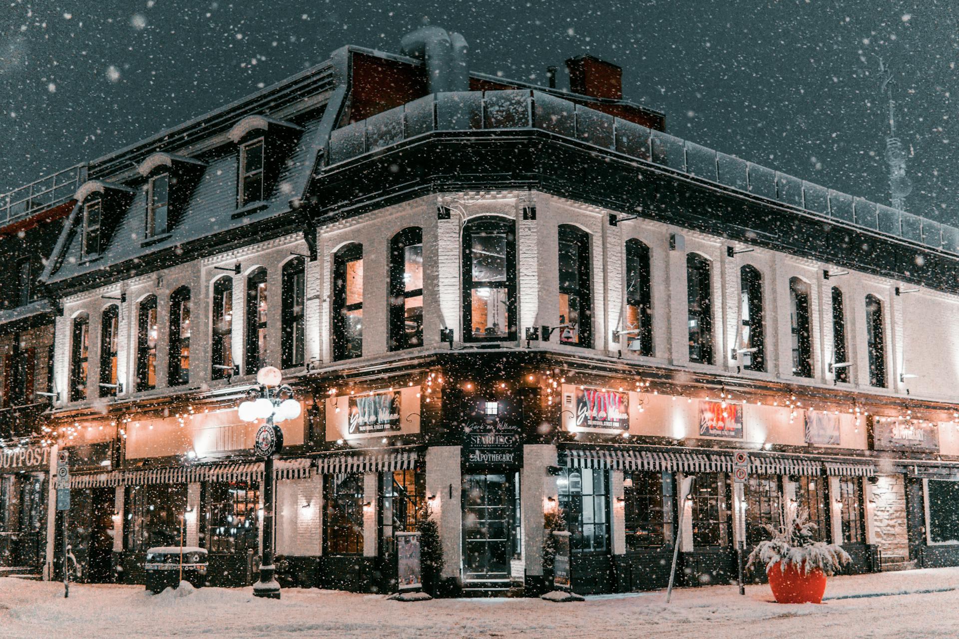 The photograph shows a restaurant in downtown Ottawa with snowfall all around.