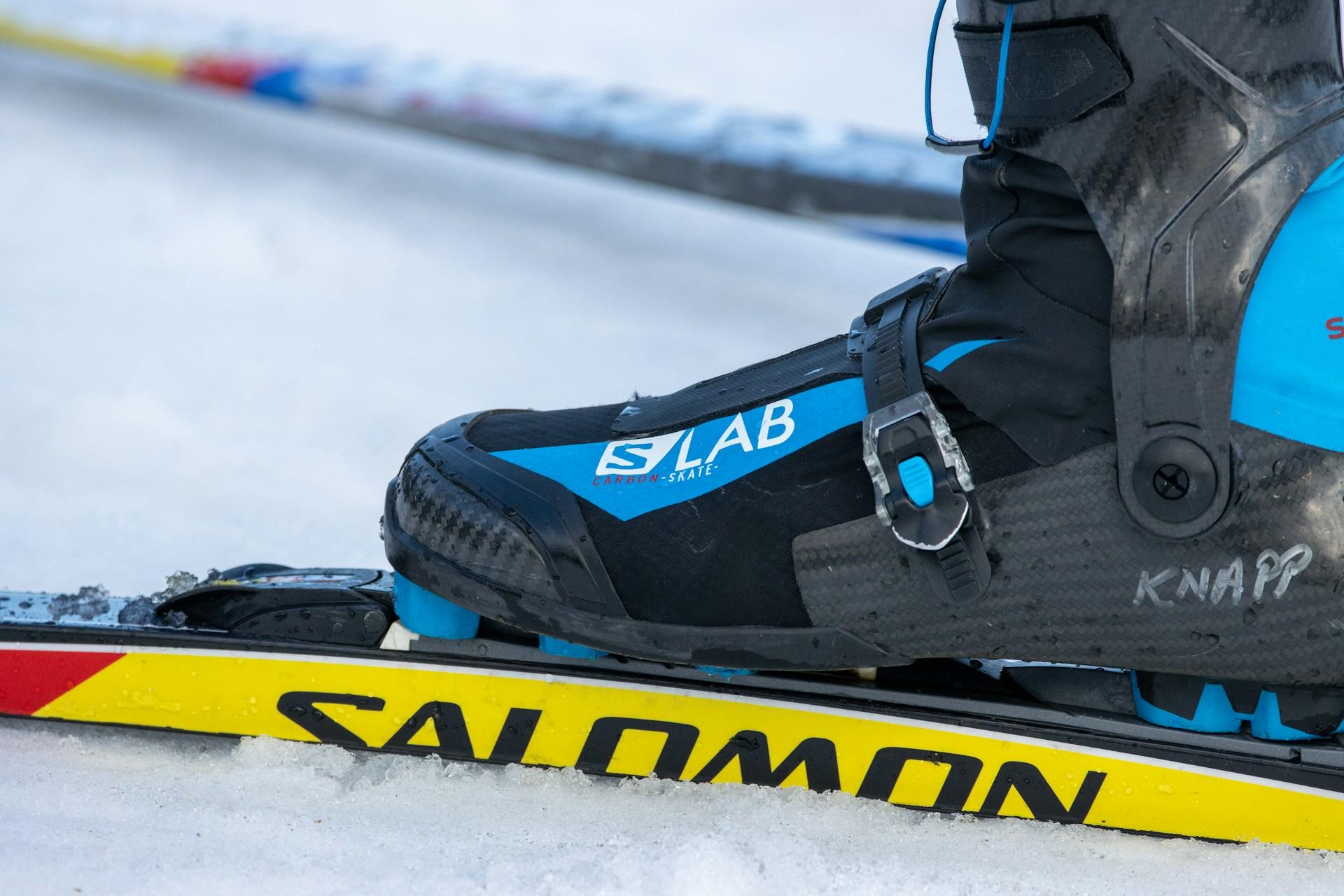 A ski boot attached to a ski.