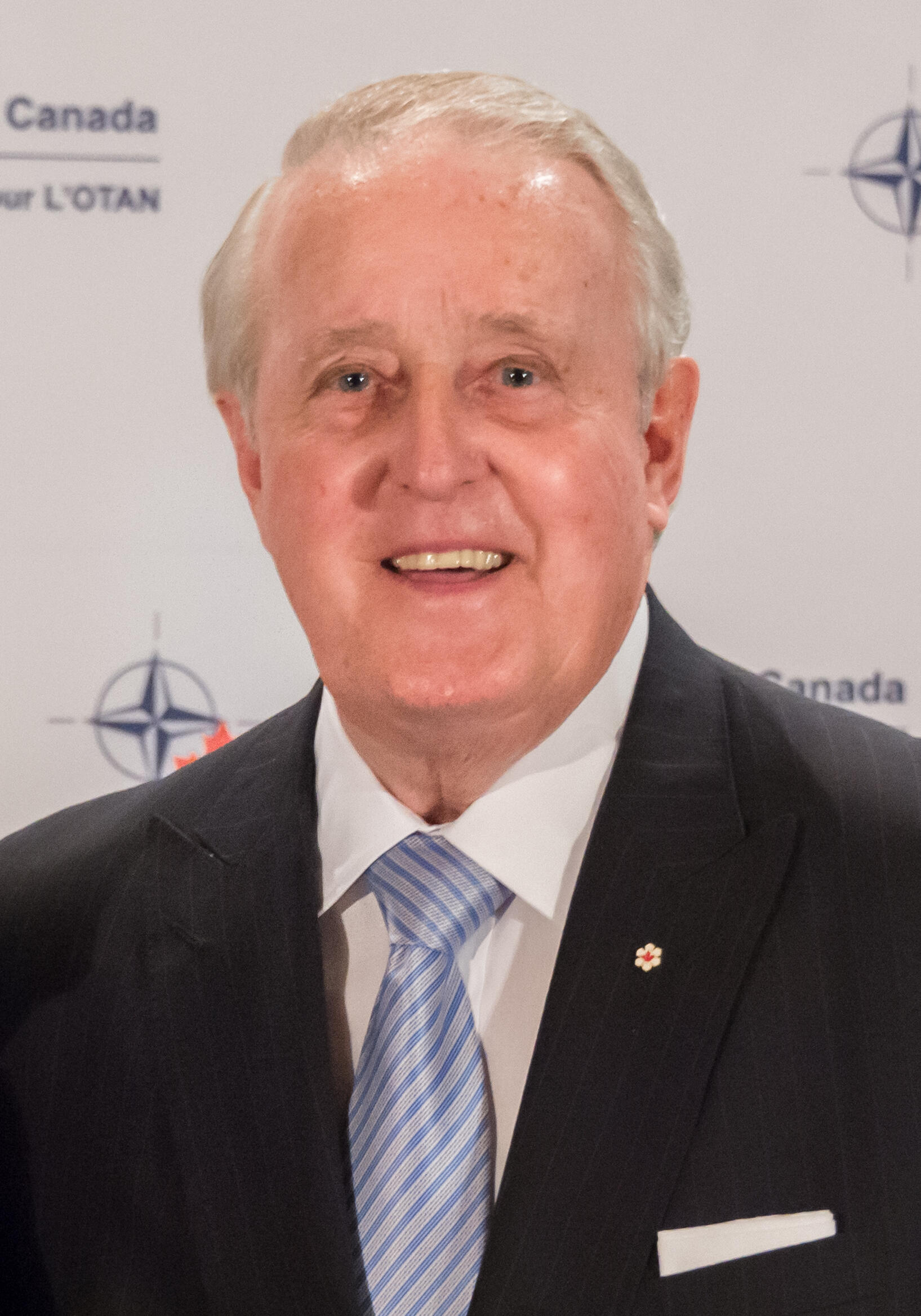 potrait of Brian Mulroney wearing a blue tie