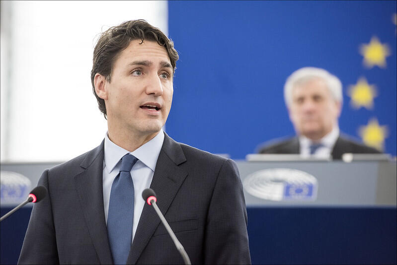 Justin Trudedau giving a speech during an European Union event.
