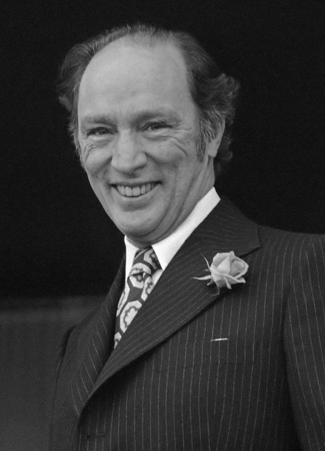 picture of pierre trudeau smiling at a political reception
