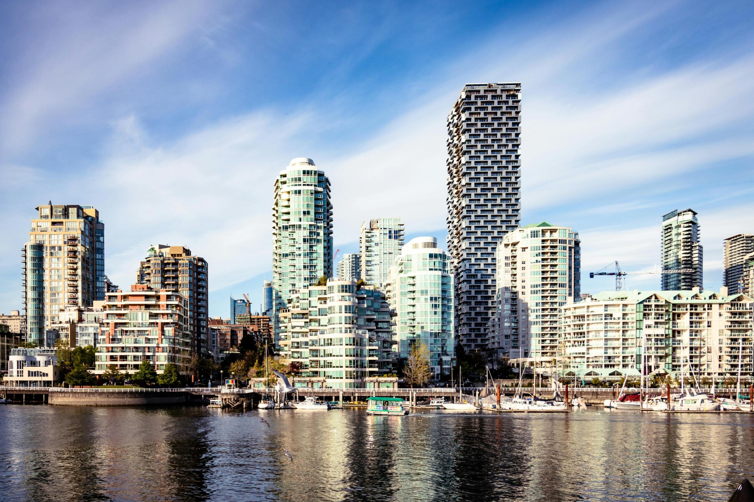 A photo of a city skyline. Many of the buildings appear to be made out of glass.