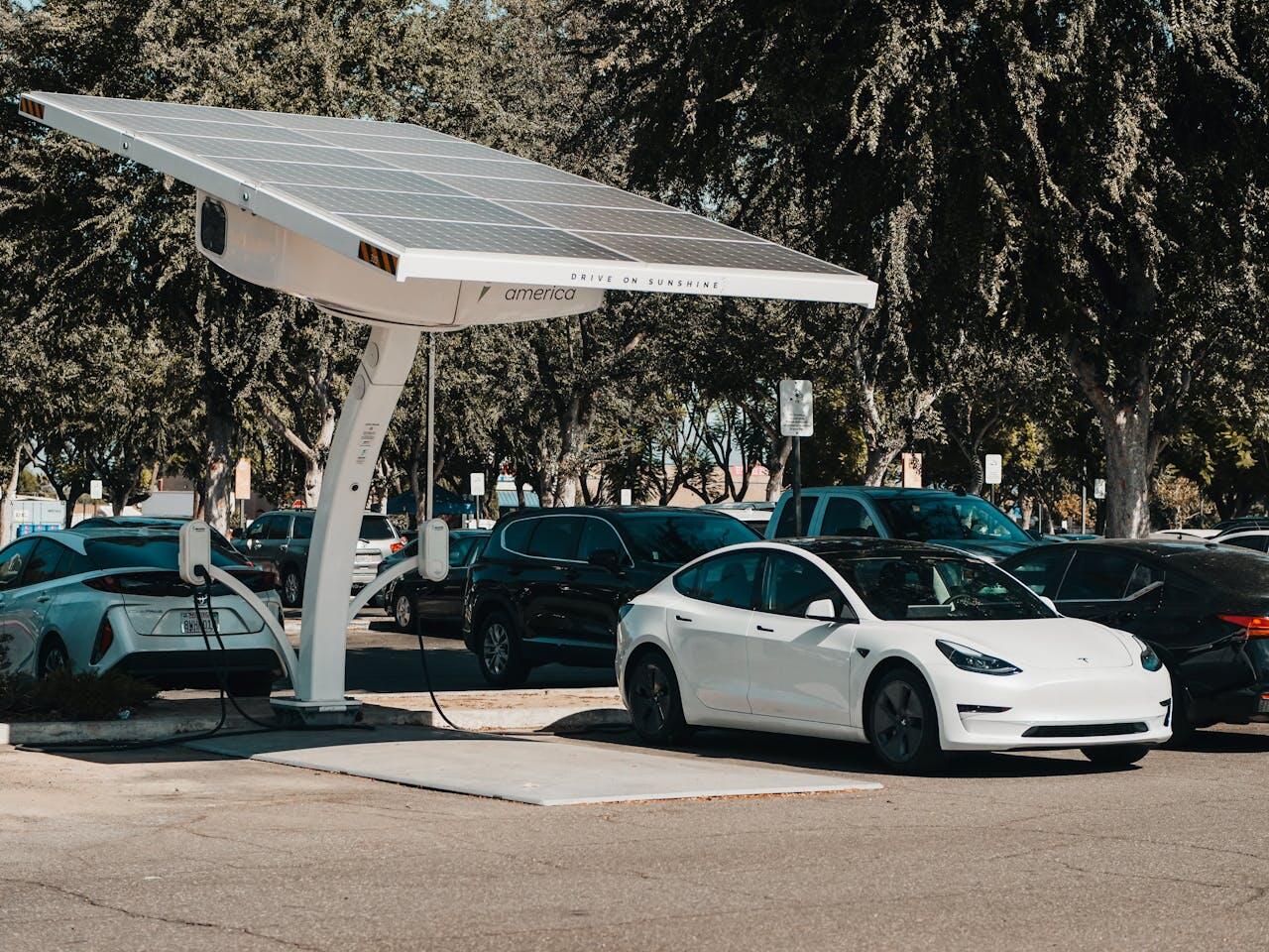 an electric car being charged by a solar panel infrastructure.