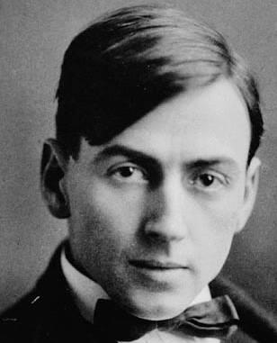 a black and white photo of a young man in a bowtie.