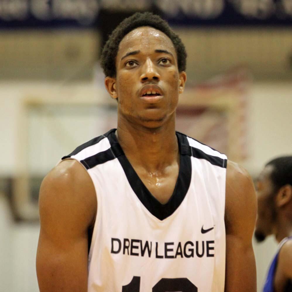 The famous basketball player DeMar DeRozan in a white uniform.