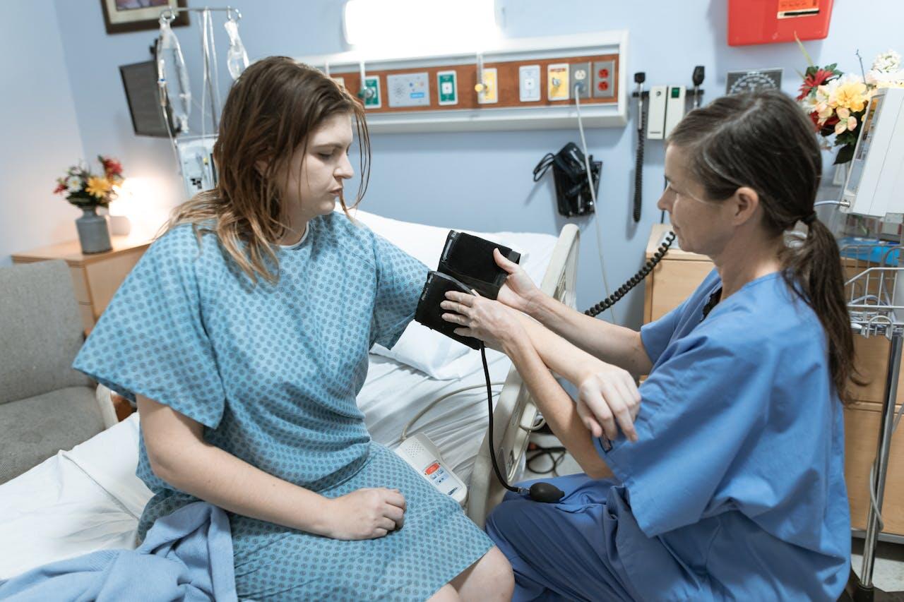 A nurse checks the blood pressure of a patient in a hospital room, with medical equipment and a soft color palette in the background.