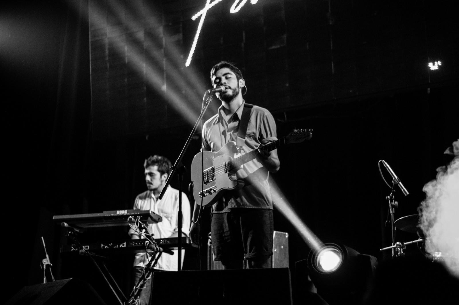 A band on stage - all of whom have learned to play guitar