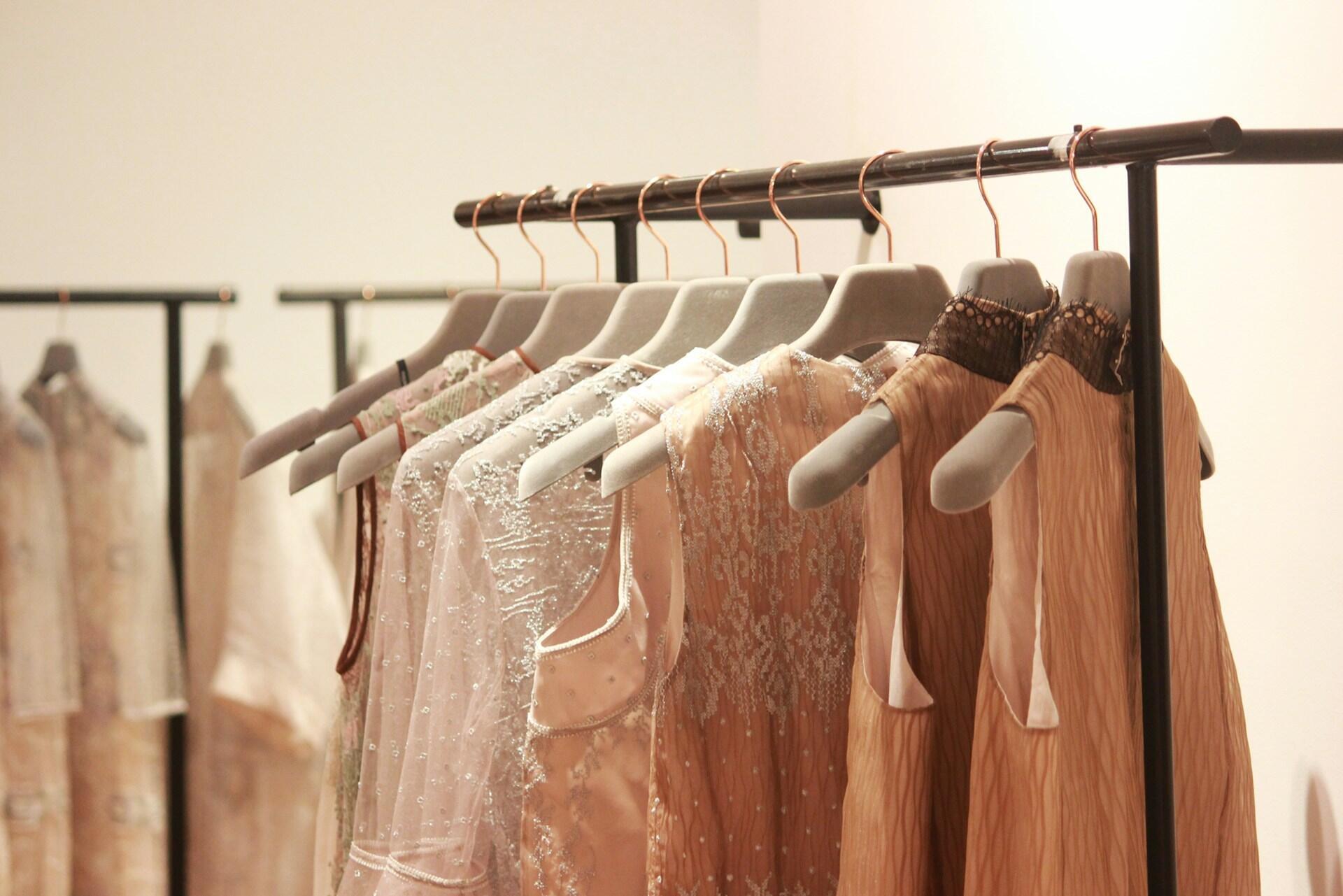 hanging rack with dresses and clothing items