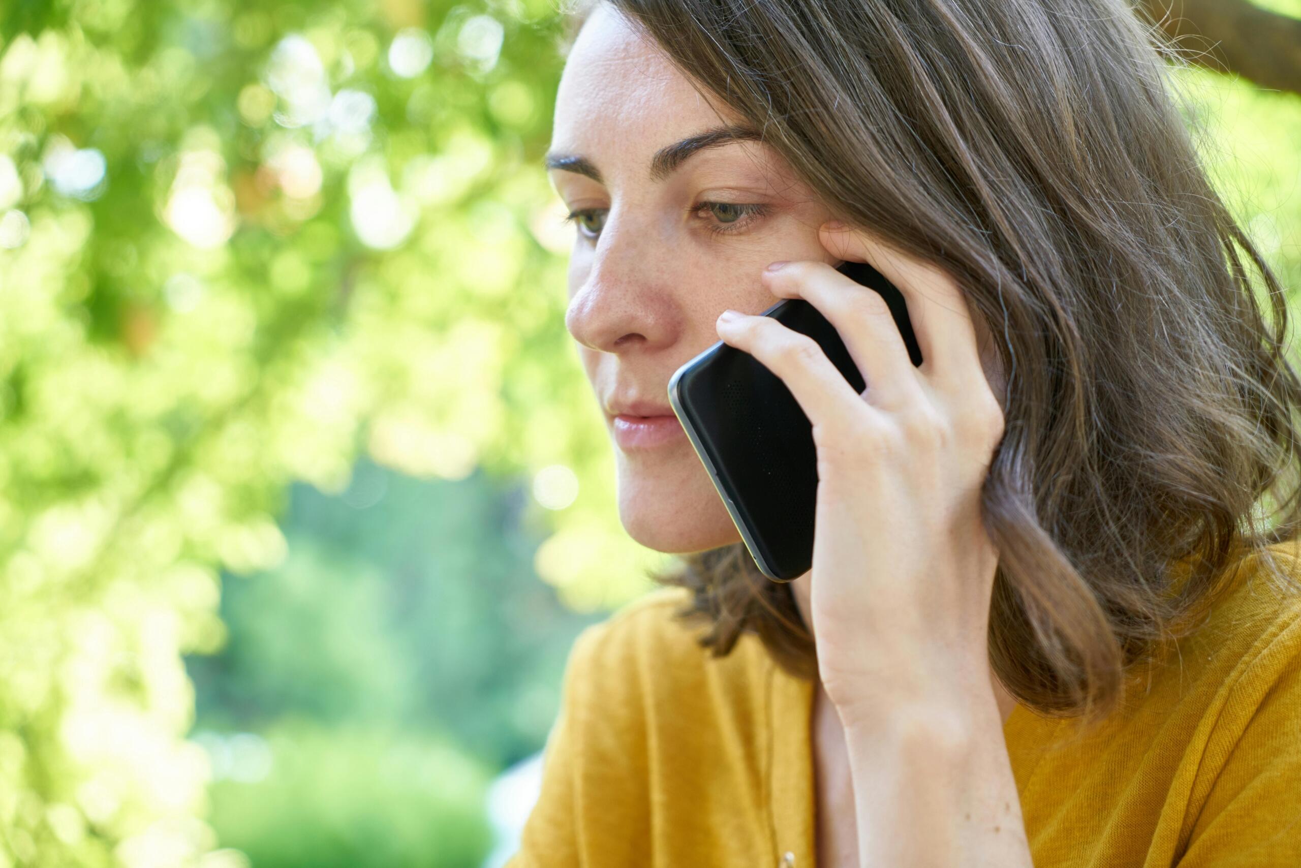 A woman holding a phone