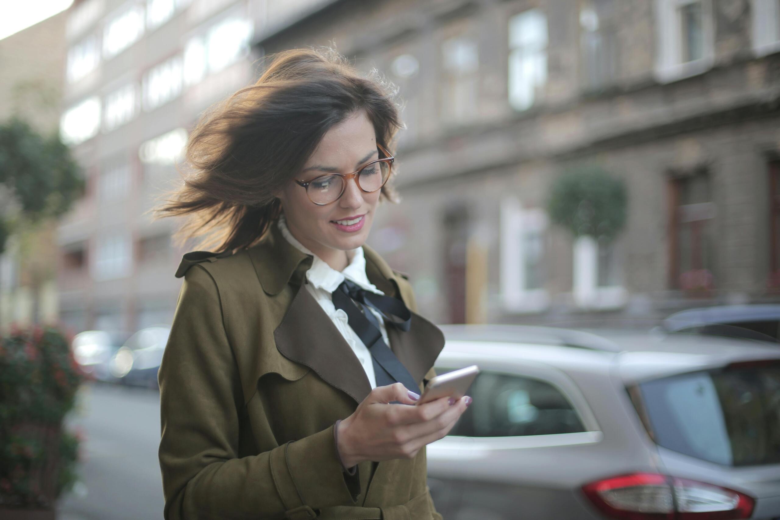 A woman holding a phone