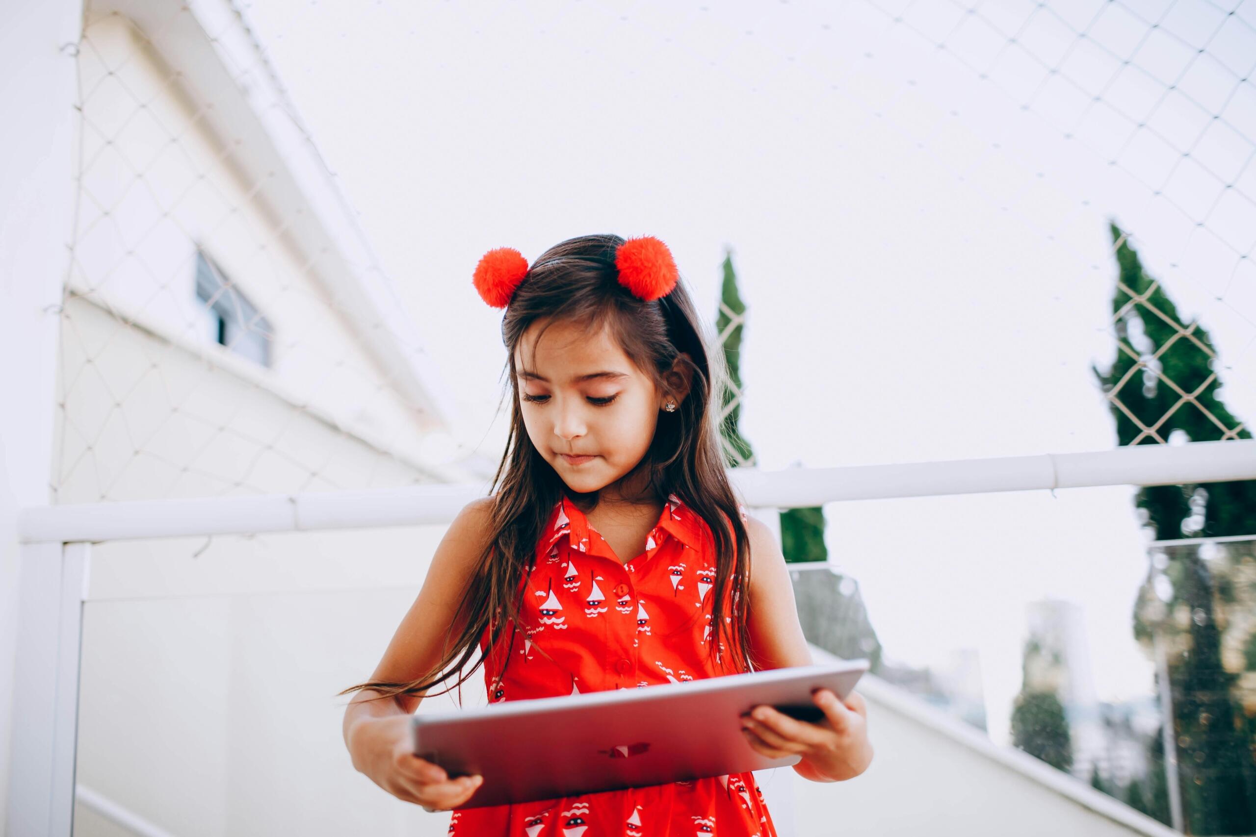 A girl holding a tablet