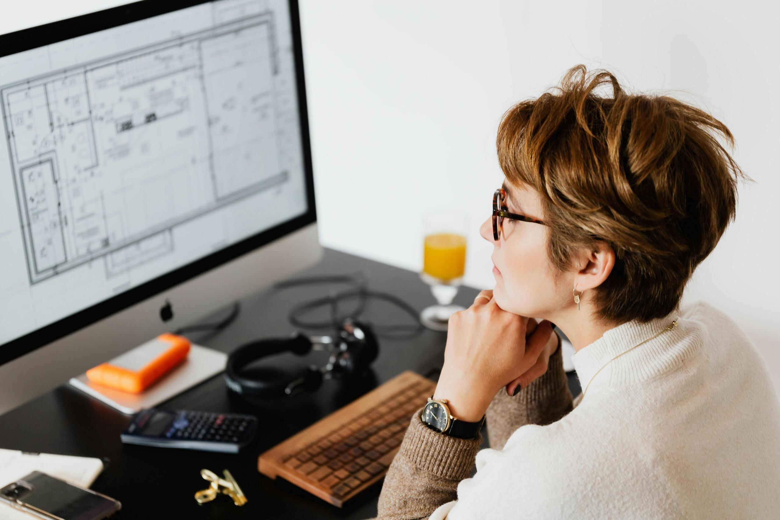 A woman looking at the computer