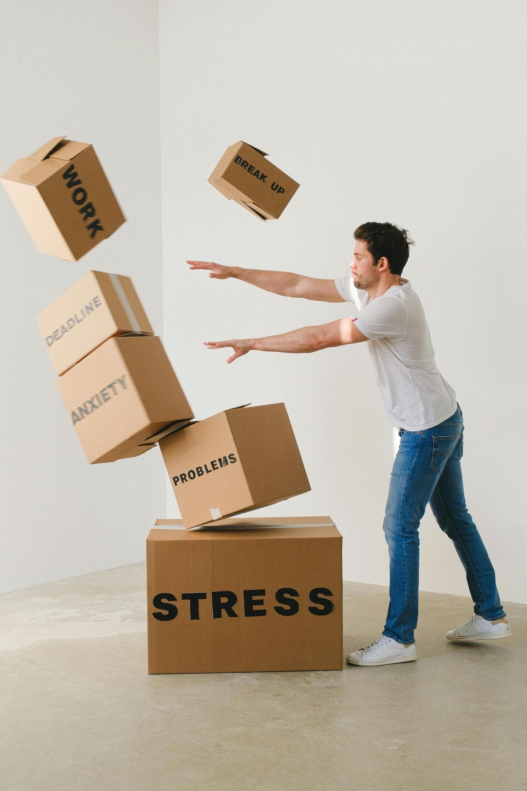 A man pushing away cartons