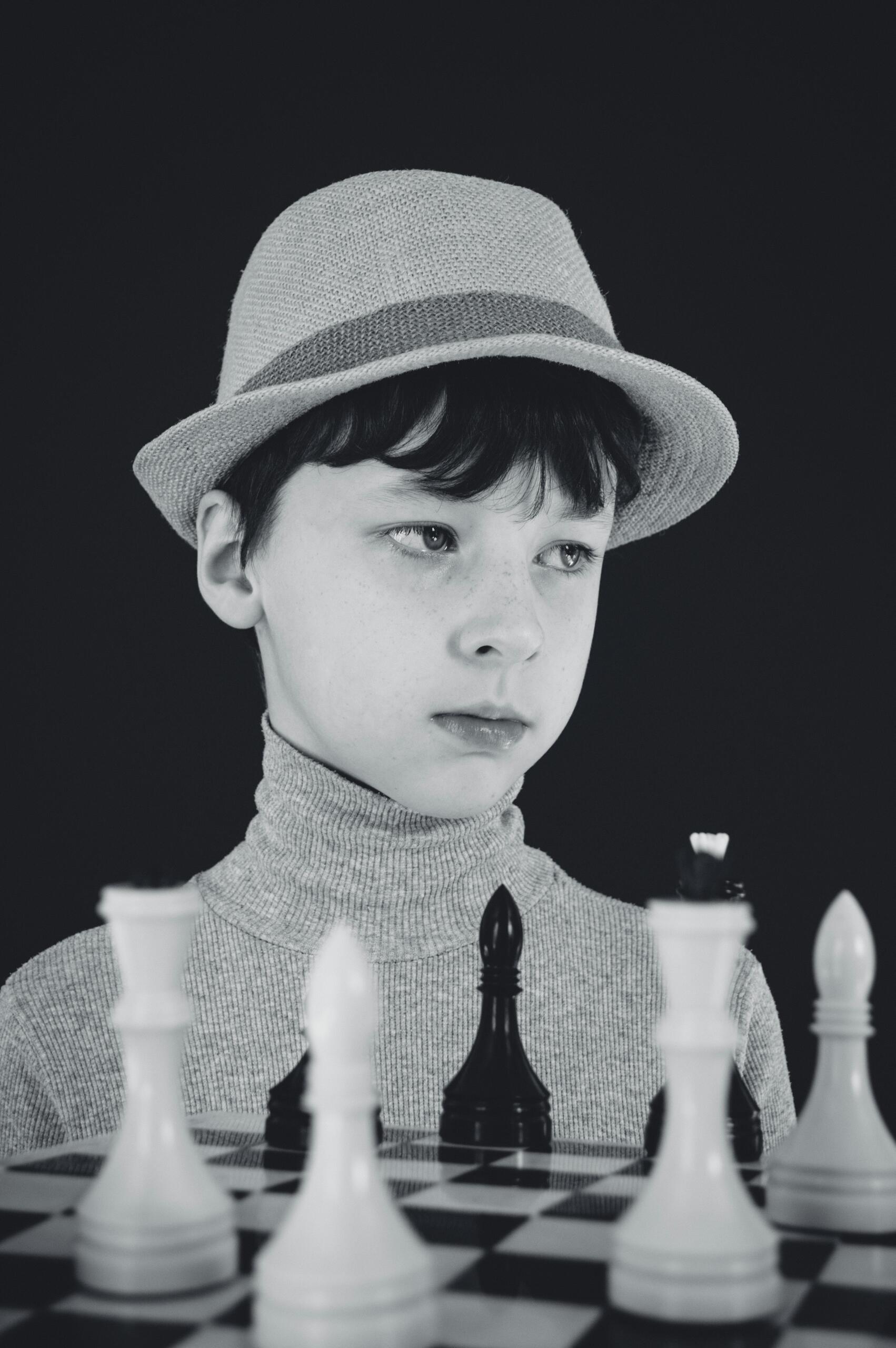 A kid playing chess
