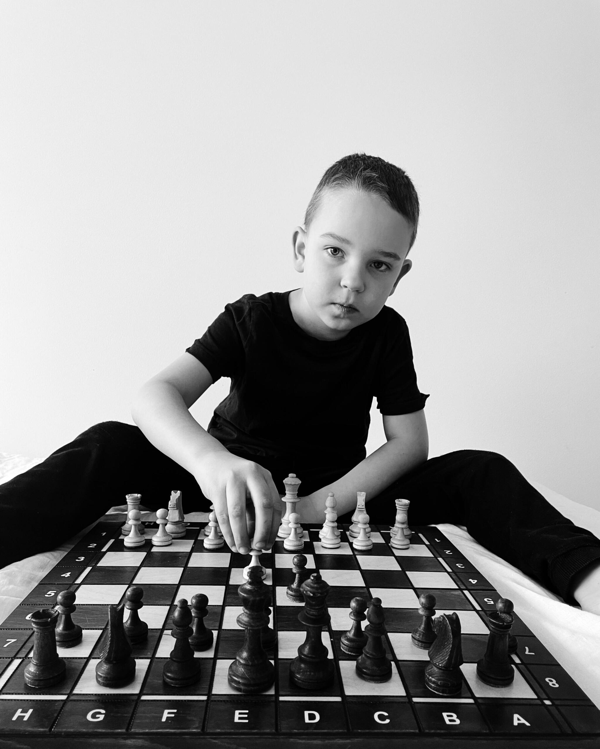 A child playing chess game for kids