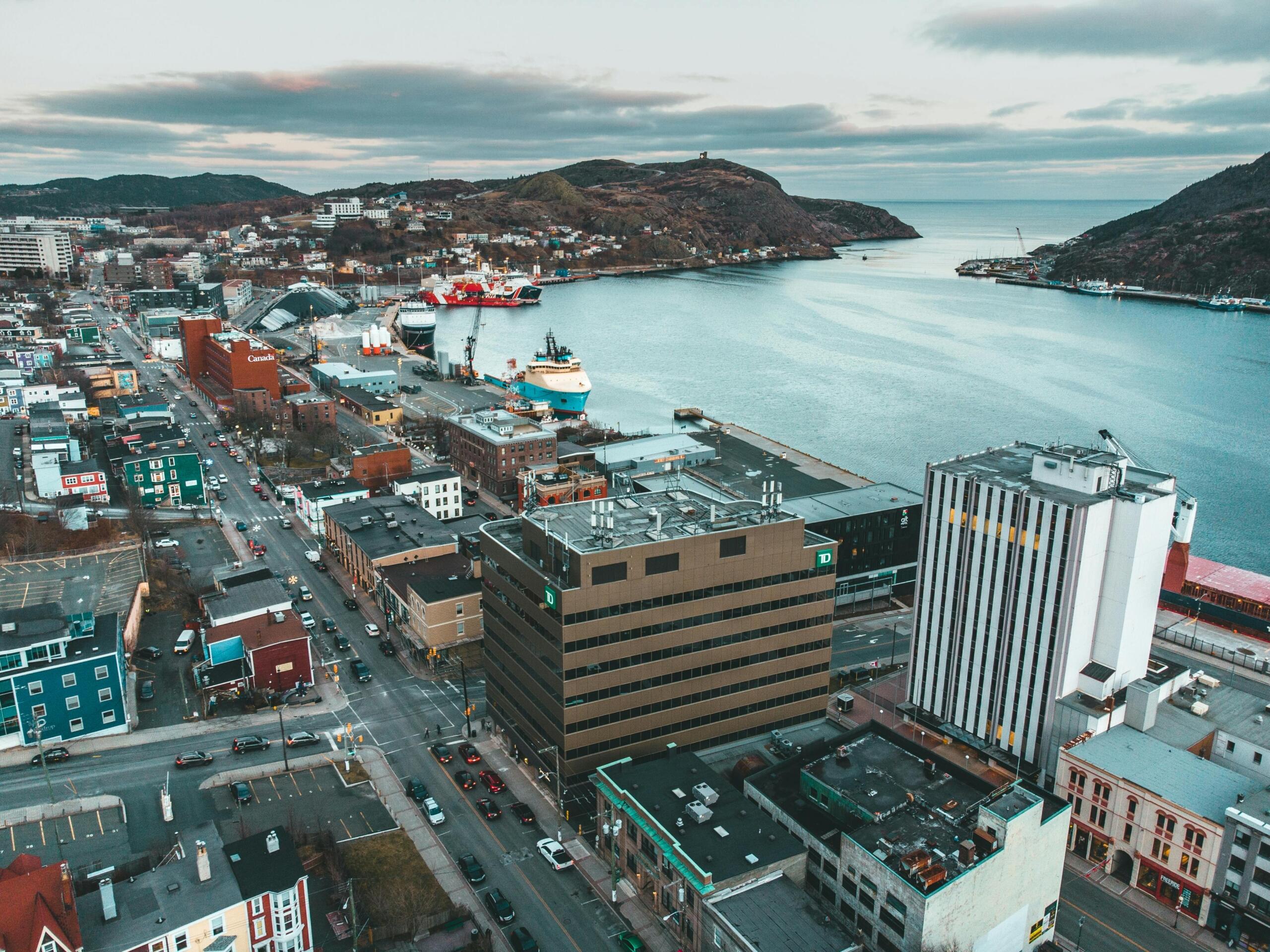 An aerial view of St. John's, Newfoundland, with the ocean in the background.