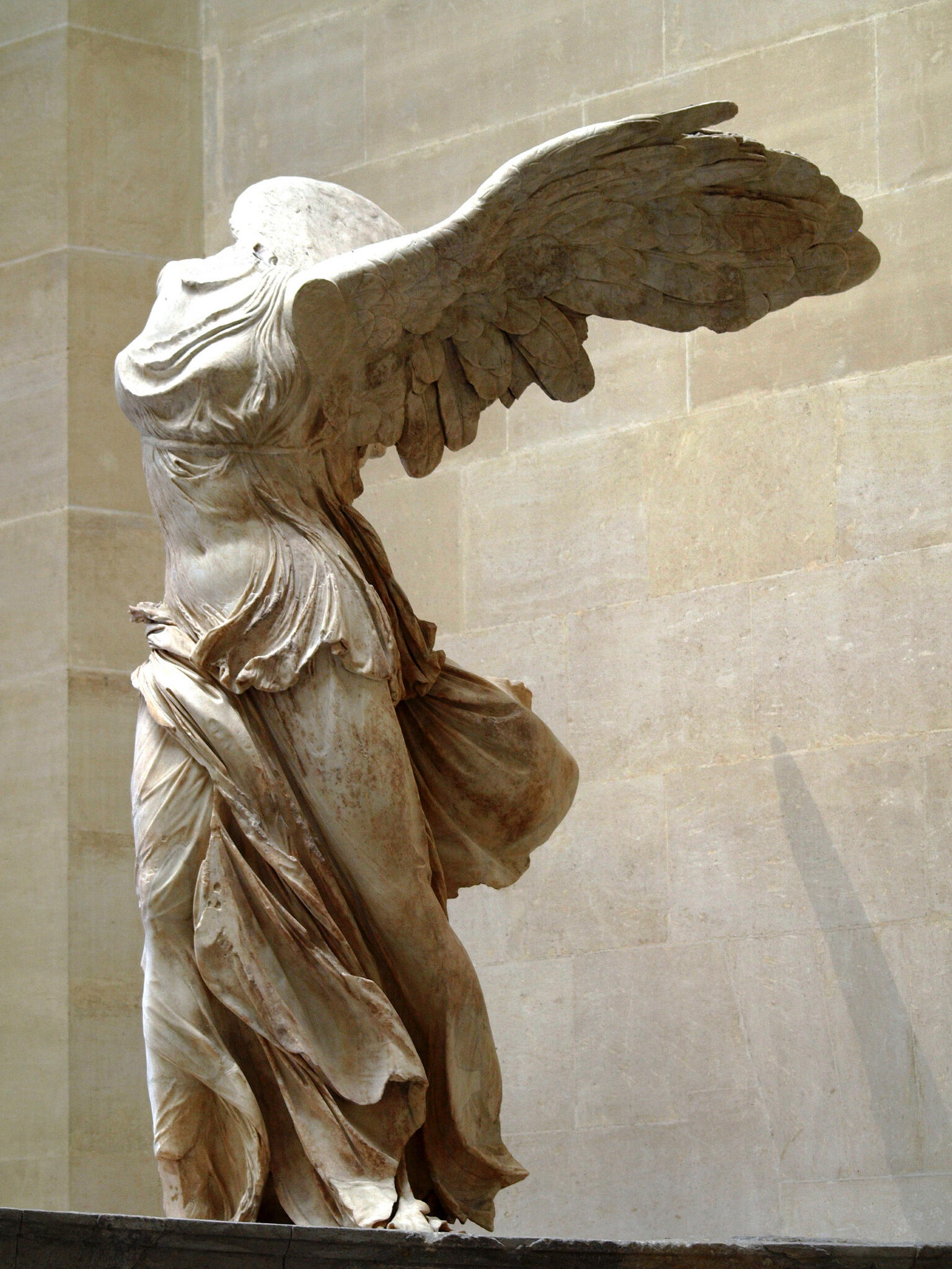 Marble statue of the Greek goddess Nike in the Louvre Museum.