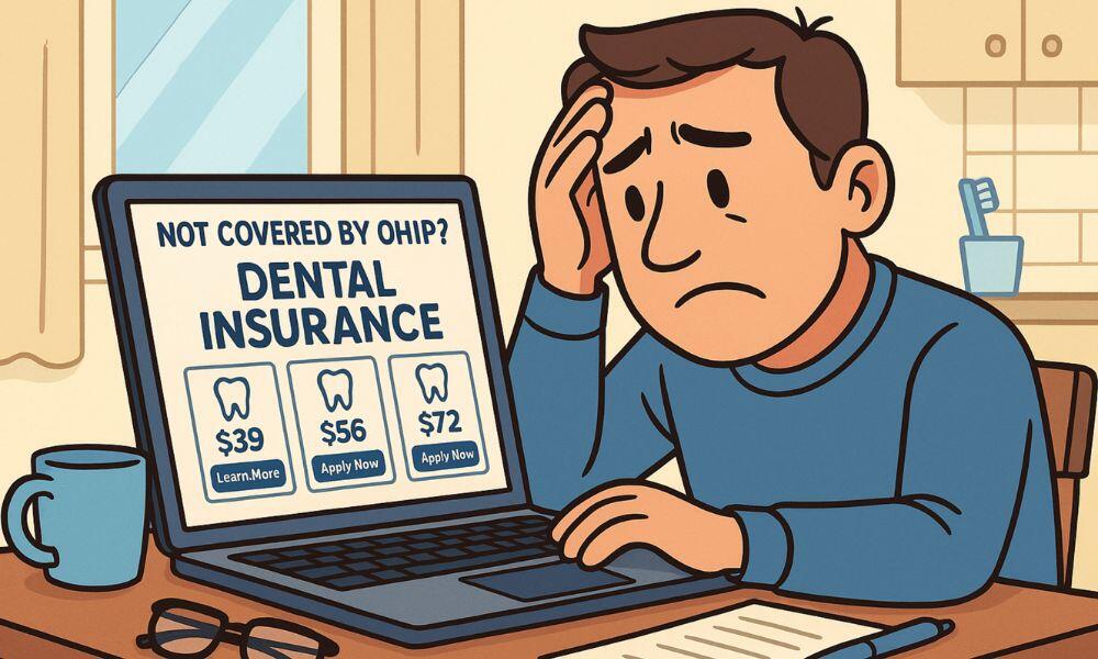 Cartoon illustration of a man sitting at a kitchen table, looking worried while viewing dental insurance options on his laptop. The screen displays a headline reading “Not Covered by OHIP? Dental Insurance” with several pricing options and buttons. A coffee mug, glasses, and toothbrush appear nearby, creating a cozy home atmosphere.