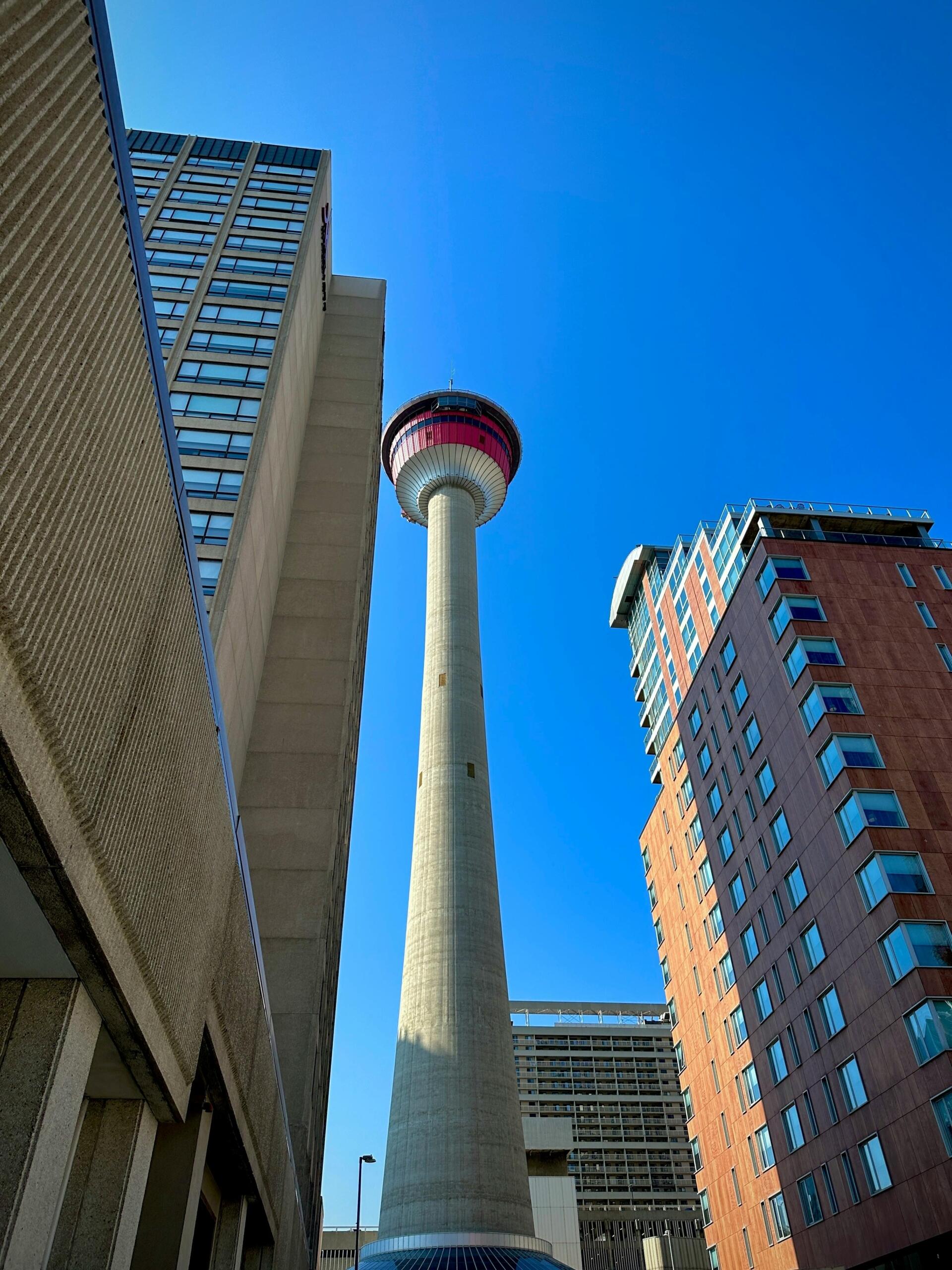 Downtown Calgary skyline featuring modern office buildings and city streets, showcasing the urban core of the city. Source: llana.