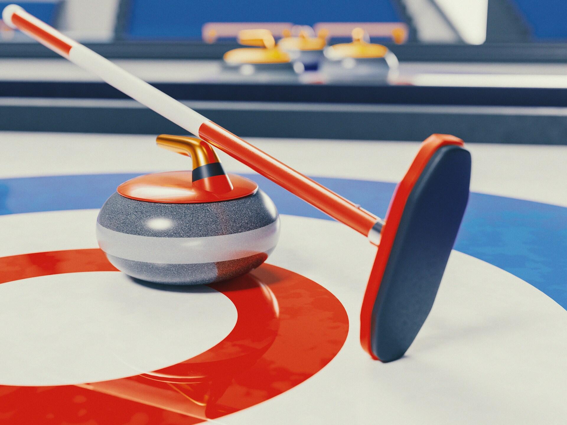 A curling stone and broom positioned on a colorful curling rink, showcasing red and blue target circles for gameplay.