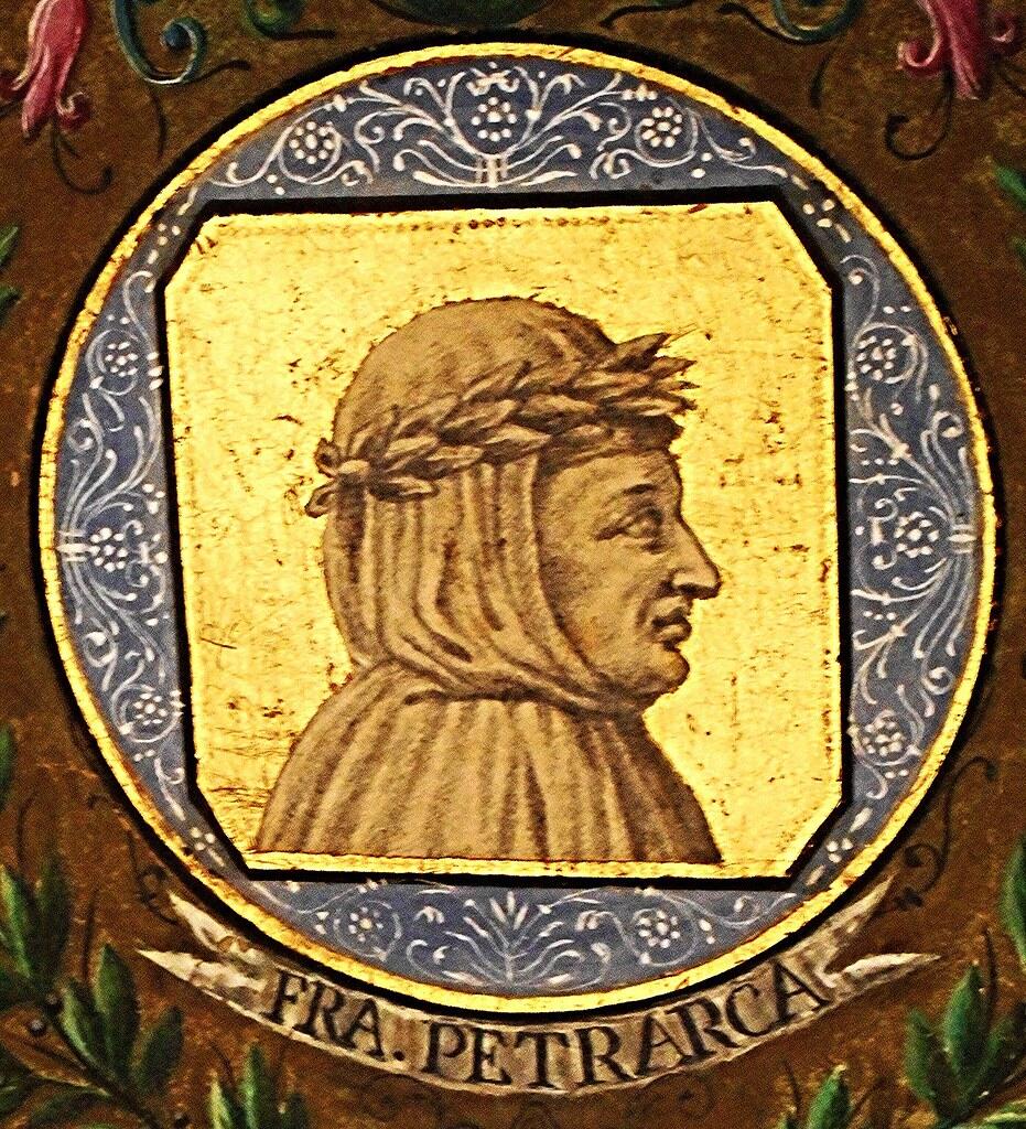 A circular portrait features a figure with a laurel crown against a gold background, adorned with decorative blue and floral borders.
