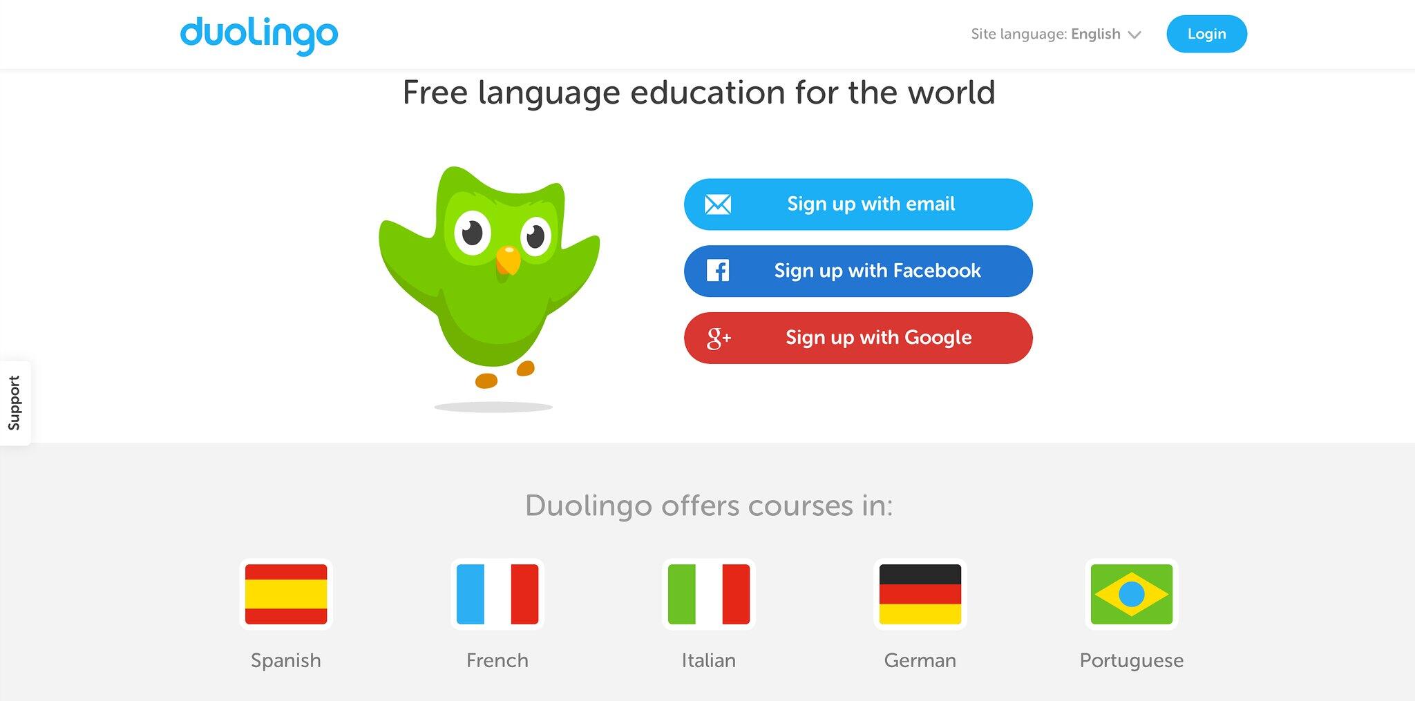 Duolingo homepage featuring a green owl mascot, sign-up options, and flags for available language courses.