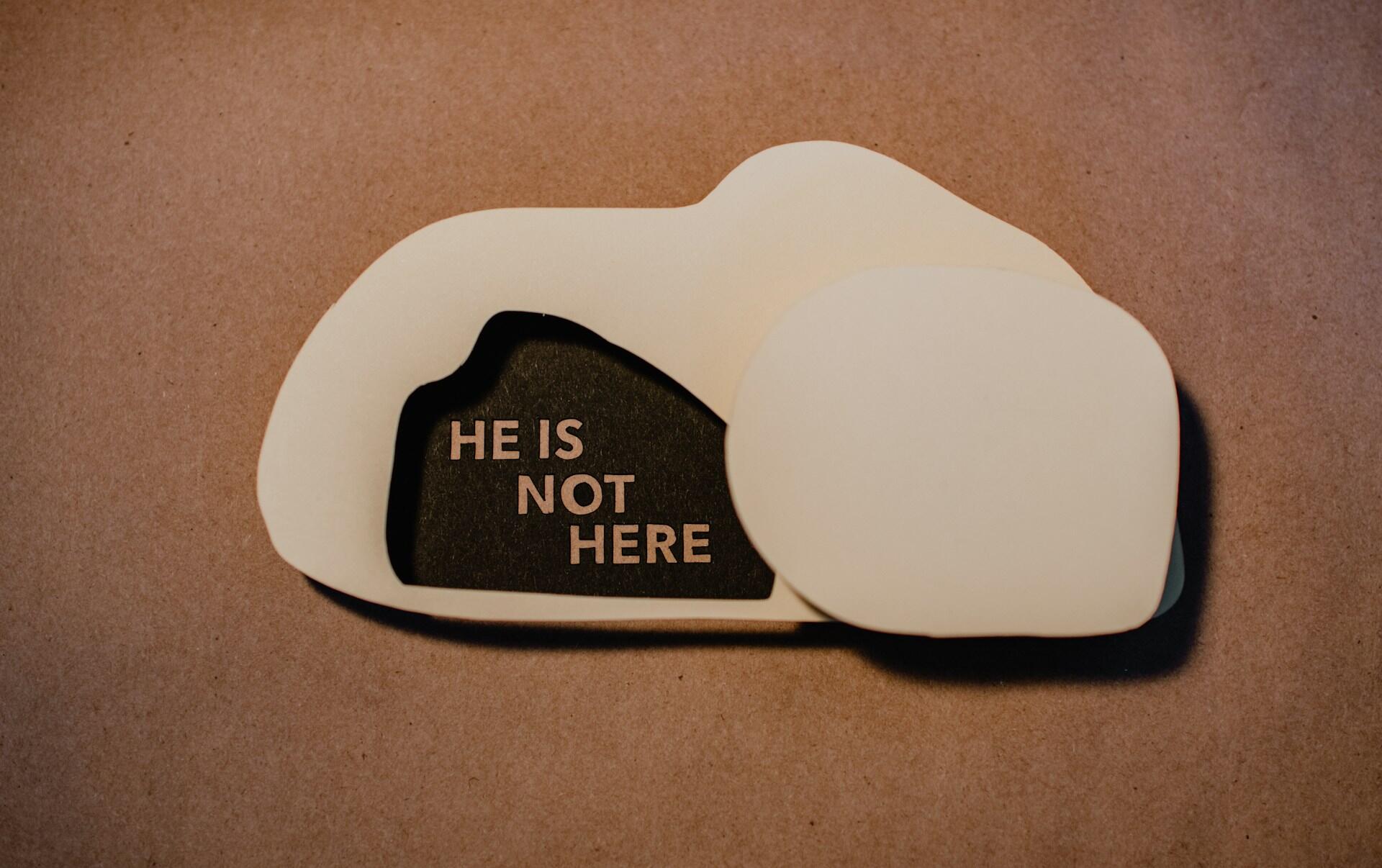 A layered paper cutout with the phrase 