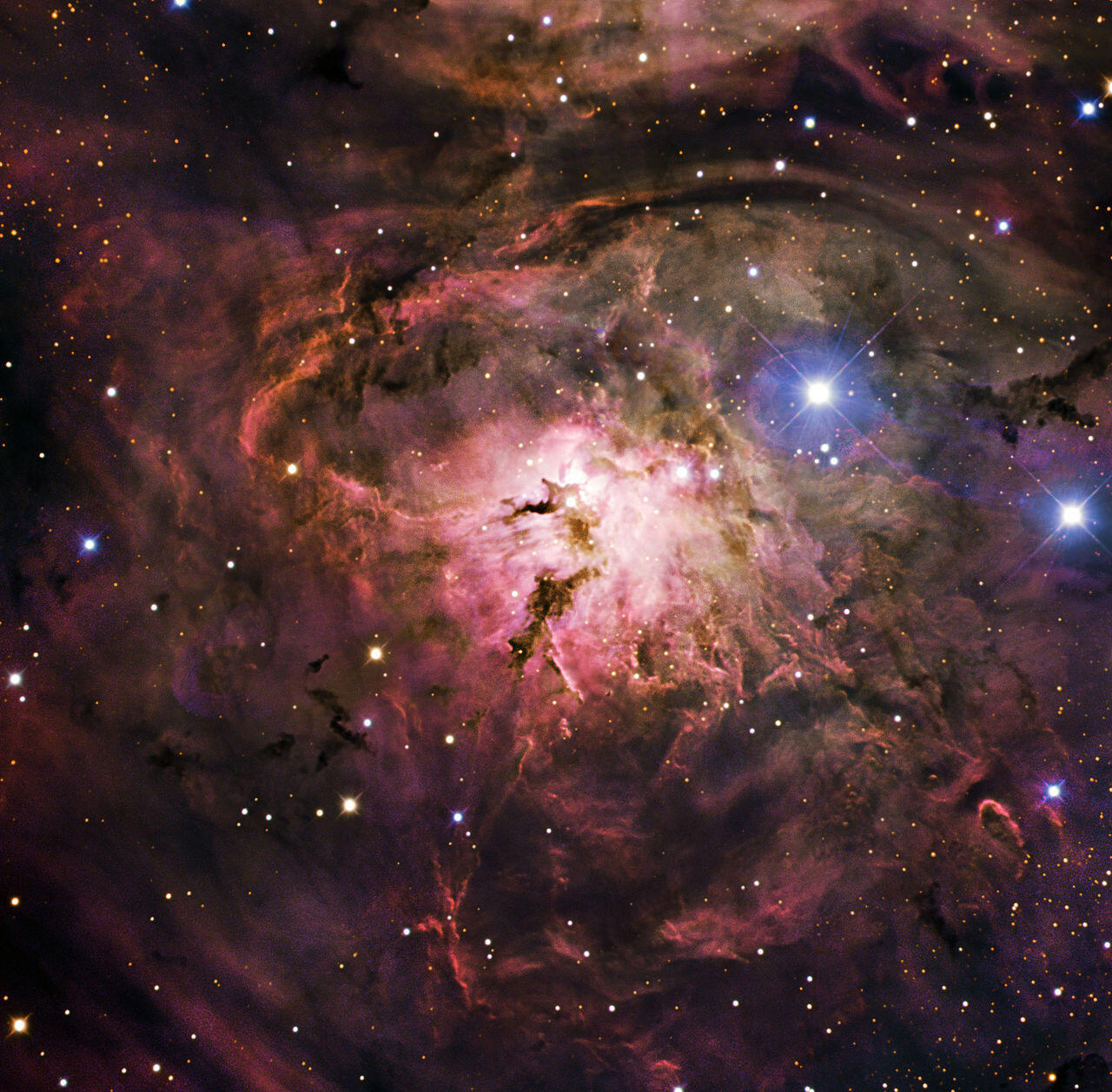 Irregular-shaped galaxy with bright clusters of stars, illustrating the aftermath of two galaxies merging in space.