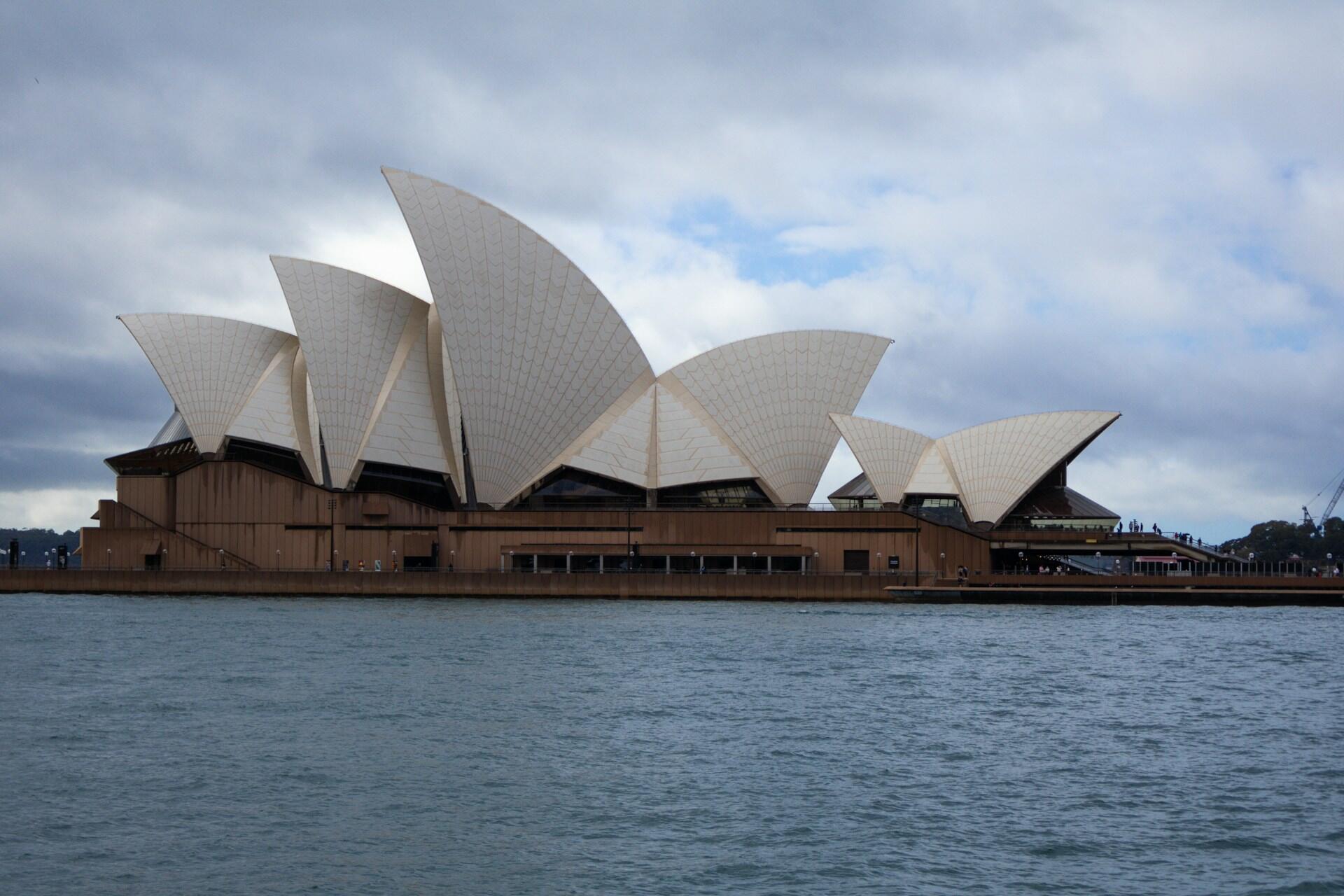 Cloudy sky with gray clouds covering most of the blue background, indicating potential rain or overcast weather.