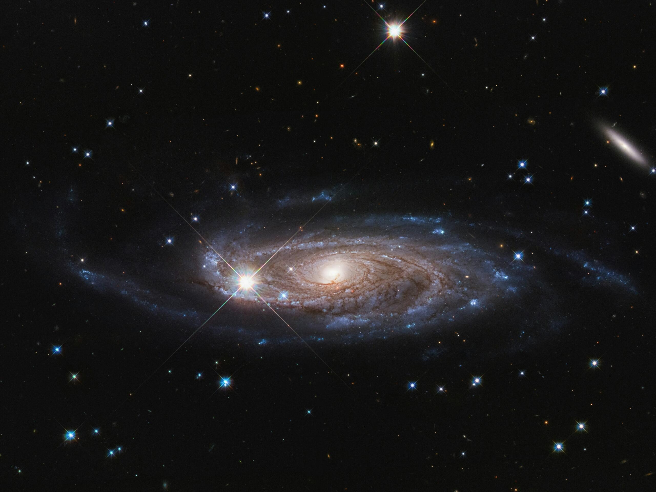 A spiral galaxy with stars in the background