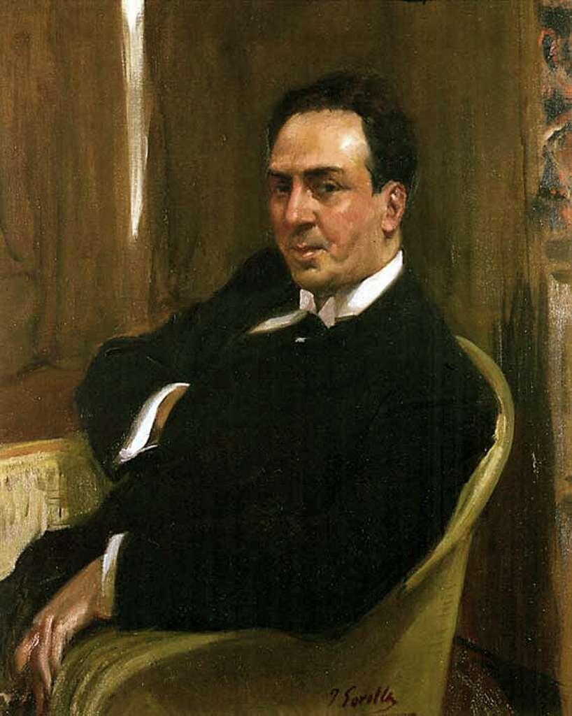 Portrait of Spanish poet Antonio Machado painted by Joaquín Sorolla in 1917. Machado is seated in a chair wearing a dark suit and white shirt, with a calm, contemplative expression against a simple indoor background.