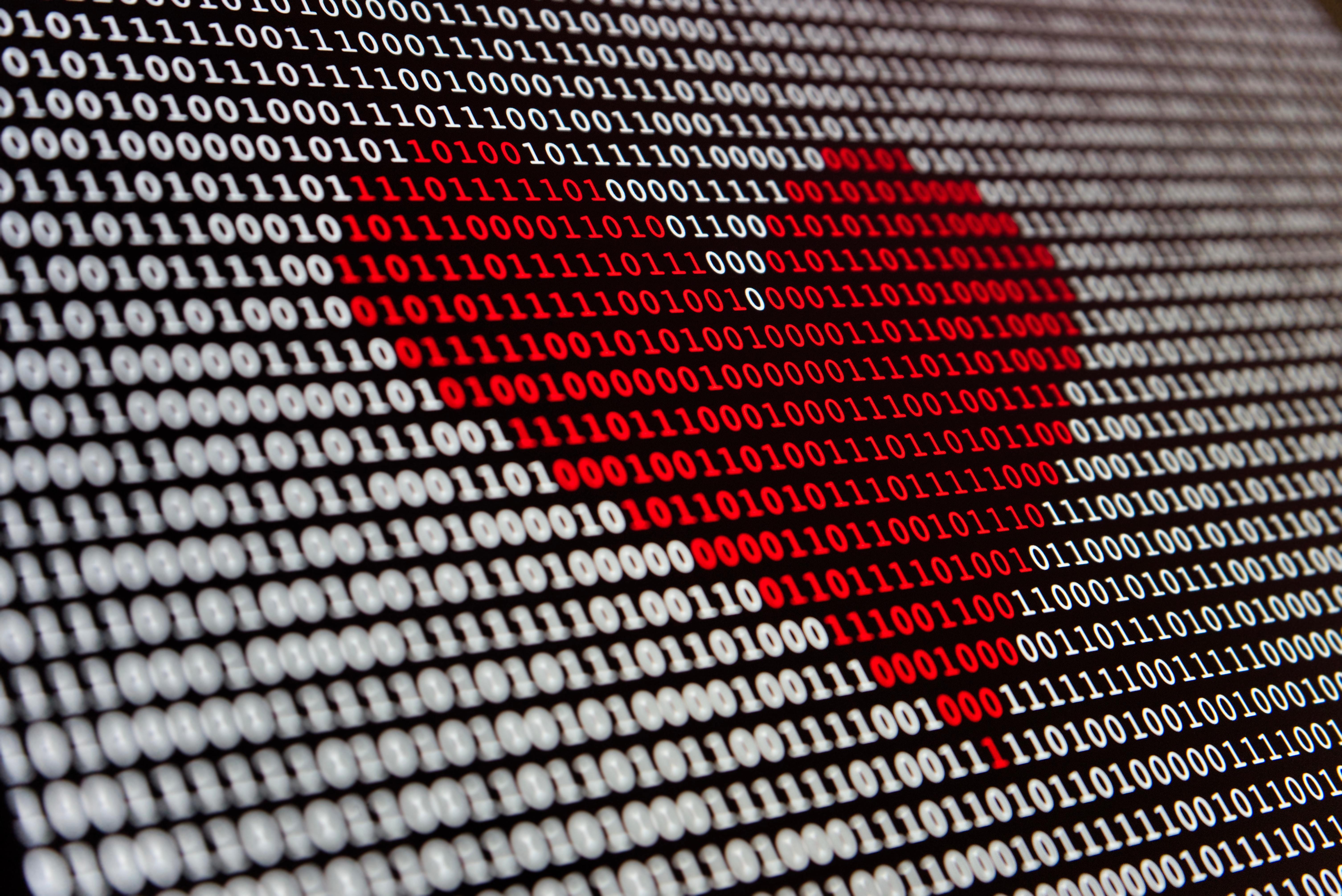 Corazón hecho con código binario