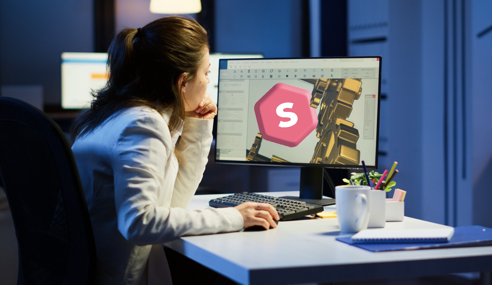 chica de lado frente a su pantalla de computadora modelando un diseño 3d con el logo de superprof