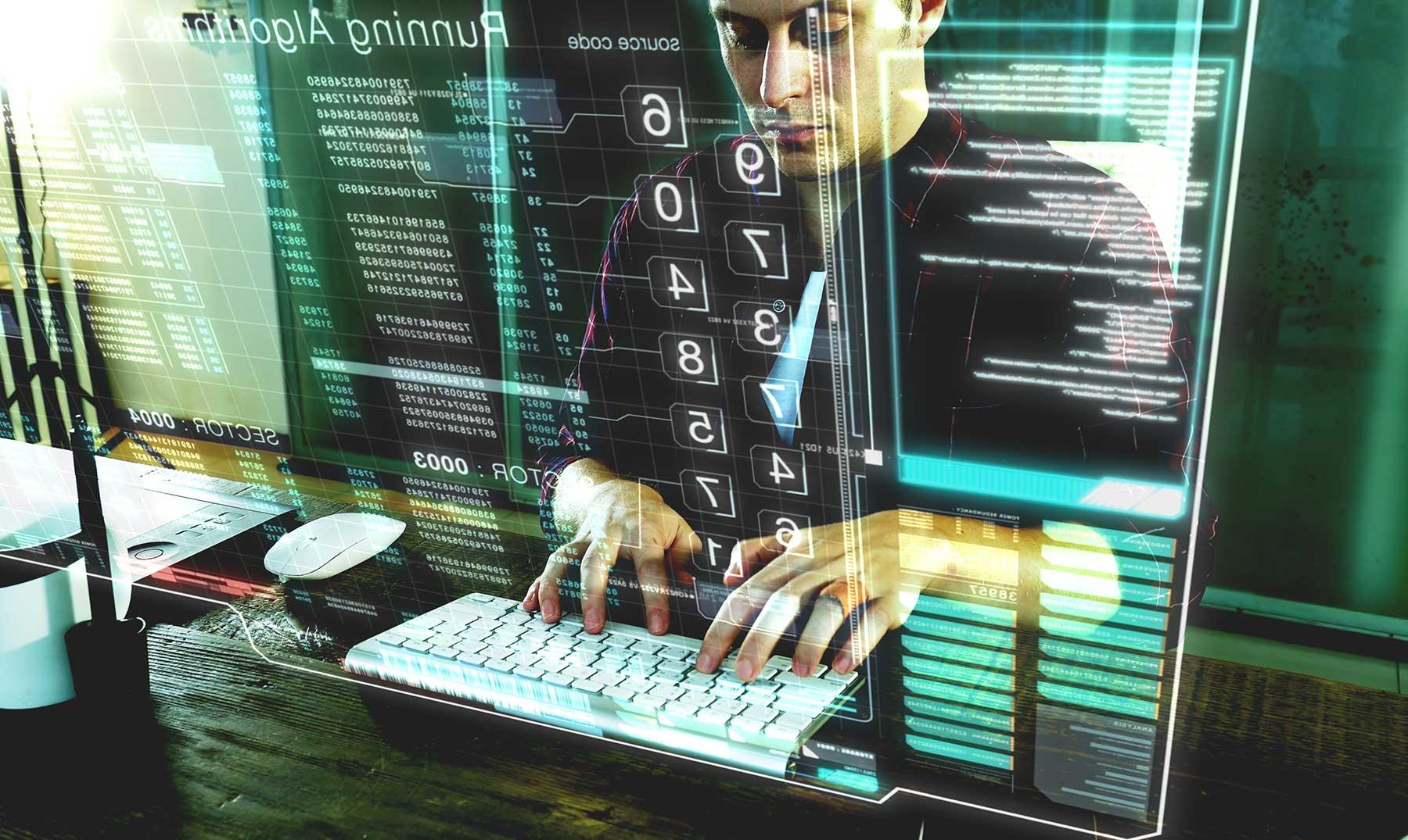 Imagen futurista de un hombre trabajando en una computadora futurista de pantalla traslucida.