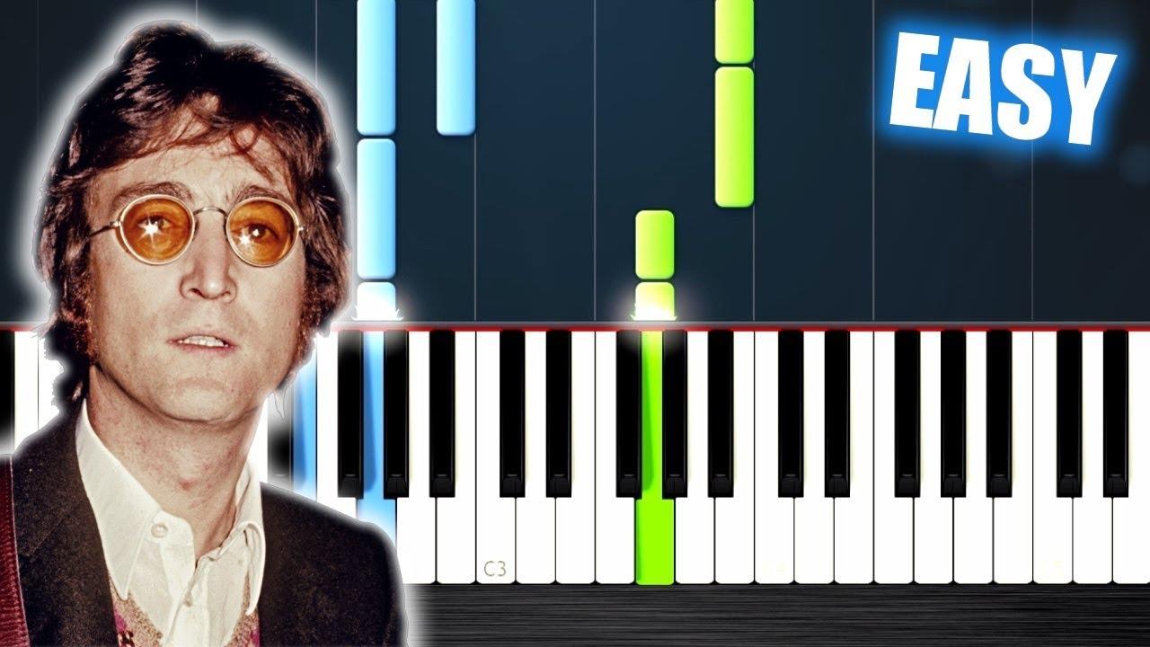 John Lennon junto a un teclado