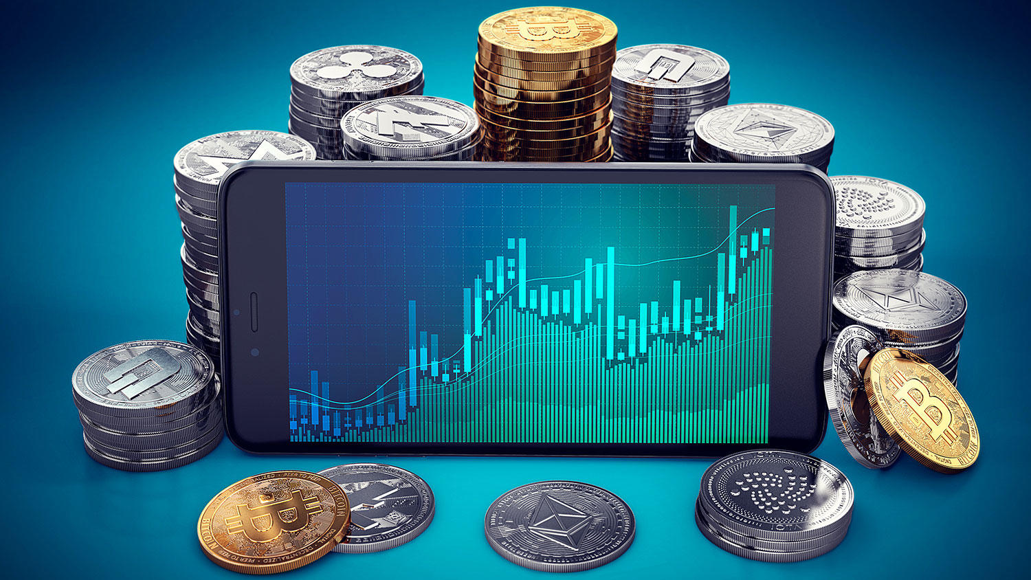 Teléfono móvil mostrando una gráfica de valores, en medio de muchas monedas.