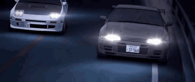 Gif. Dos autos tomando una cerrada curva