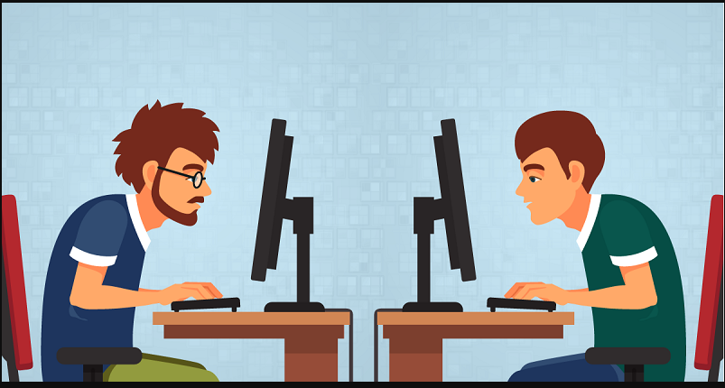 Hombres sentados frente a una computadora.